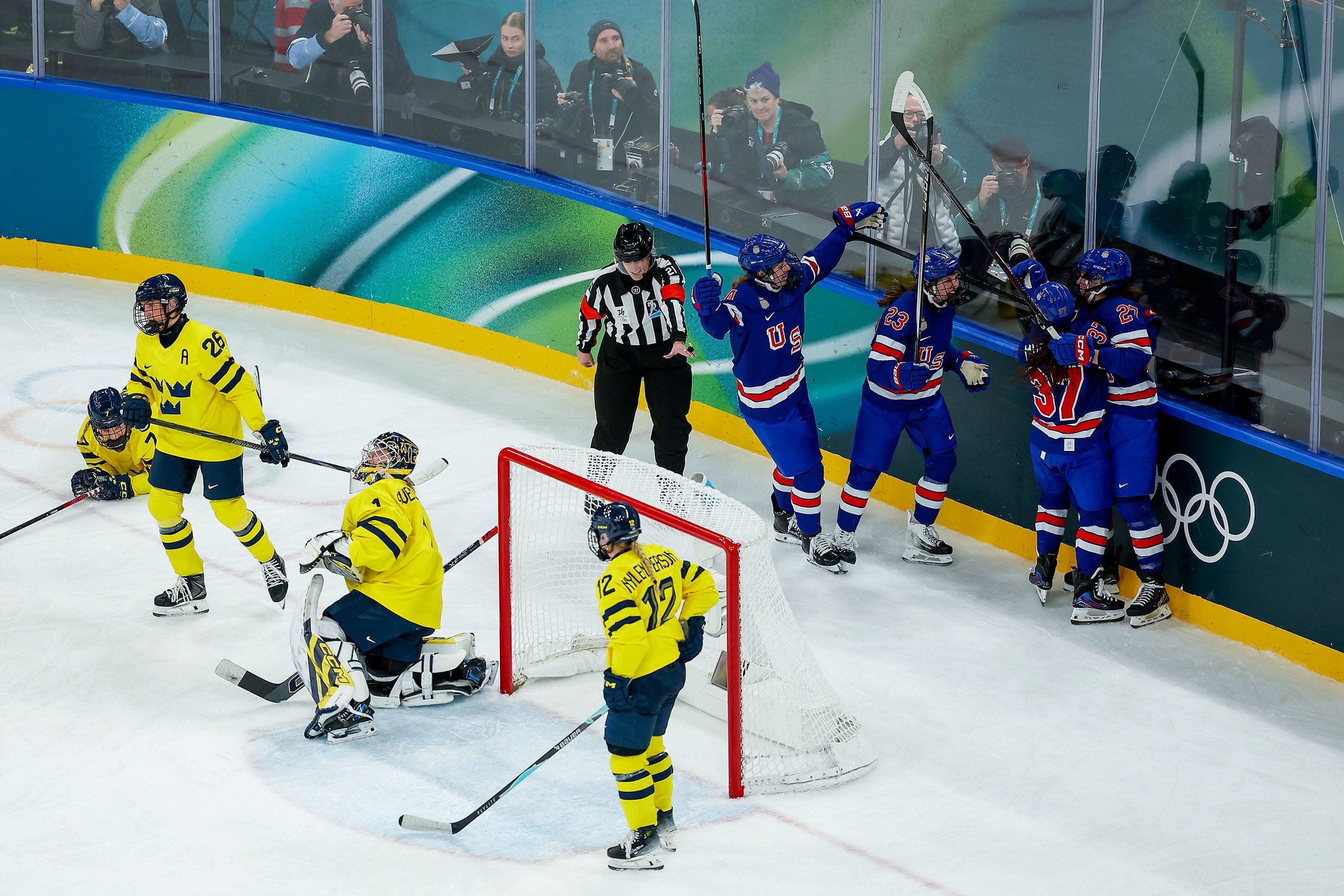Taylor Heise of Team United States celebrates with teammates.