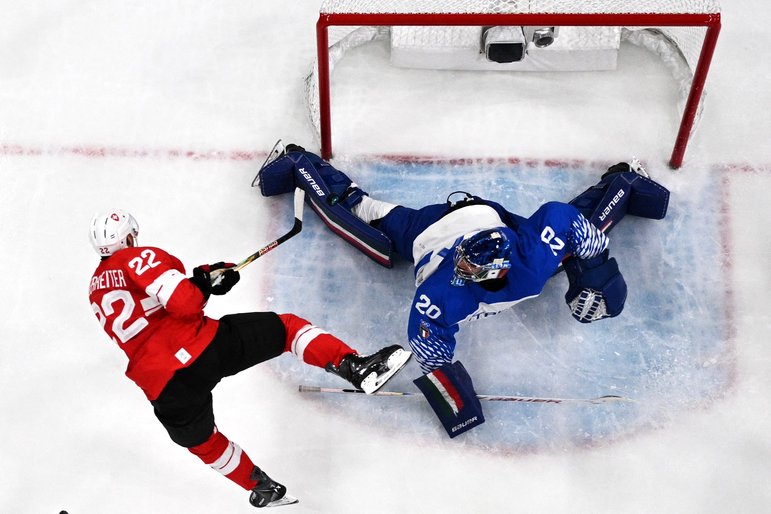 Image: IHOCKEY-OLY-2026-MILANO CORTINA-MEN-SUI-ITA