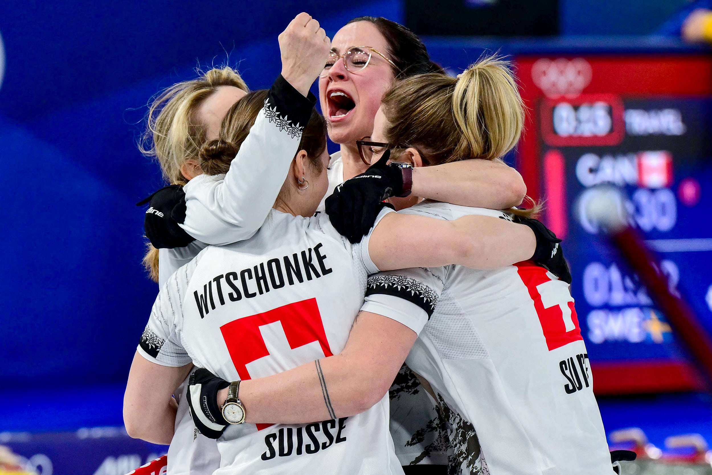 Switzerland's Carole Howald celebrates with teammates.