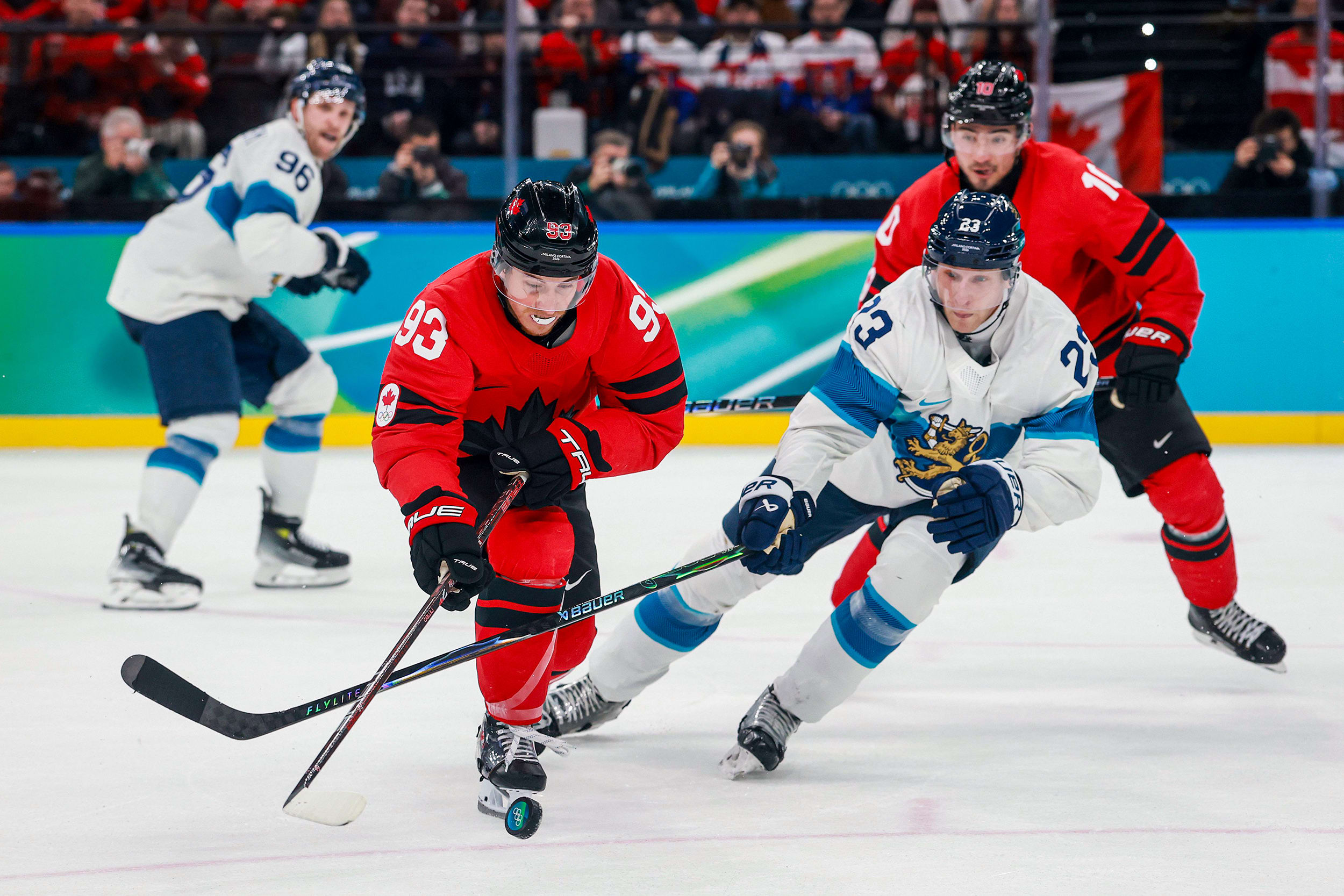 Mitch Marner of Team Canada controls the puck against Esa Lindell of Team Finland.