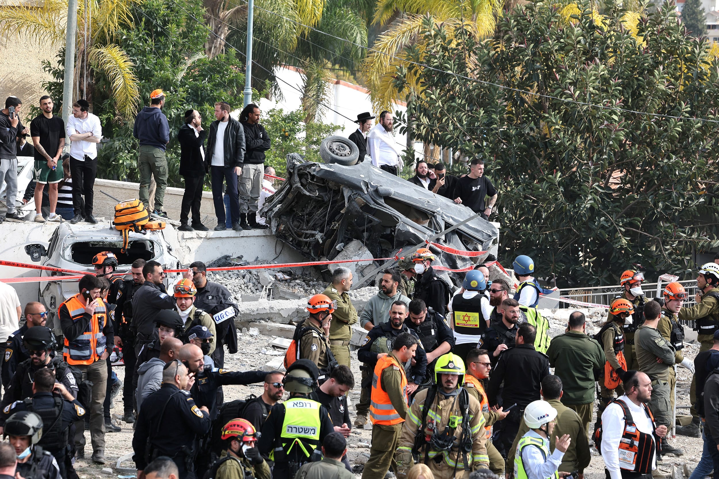 Israeli emergency services secure the scene of a missile attack near Bet Shemesh, some 30 kilometres west of Jerusalem on March 1, 2026. 
