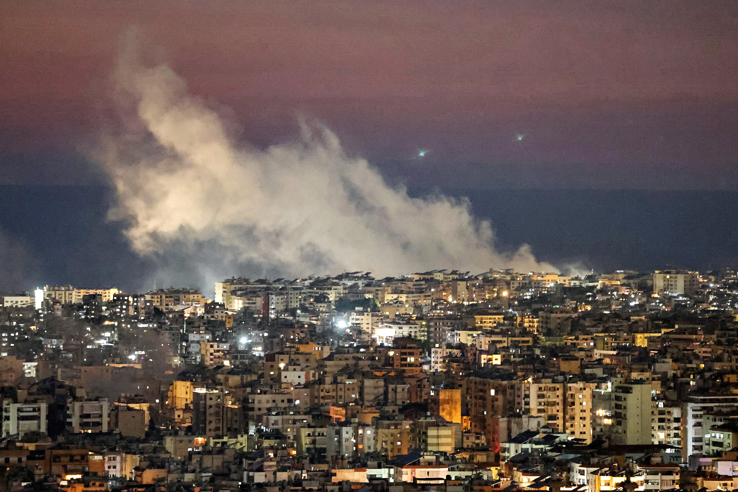 Smoke plumes billow following Israeli bombardment on Beirut's southern suburbs on March 2, 2026. 
