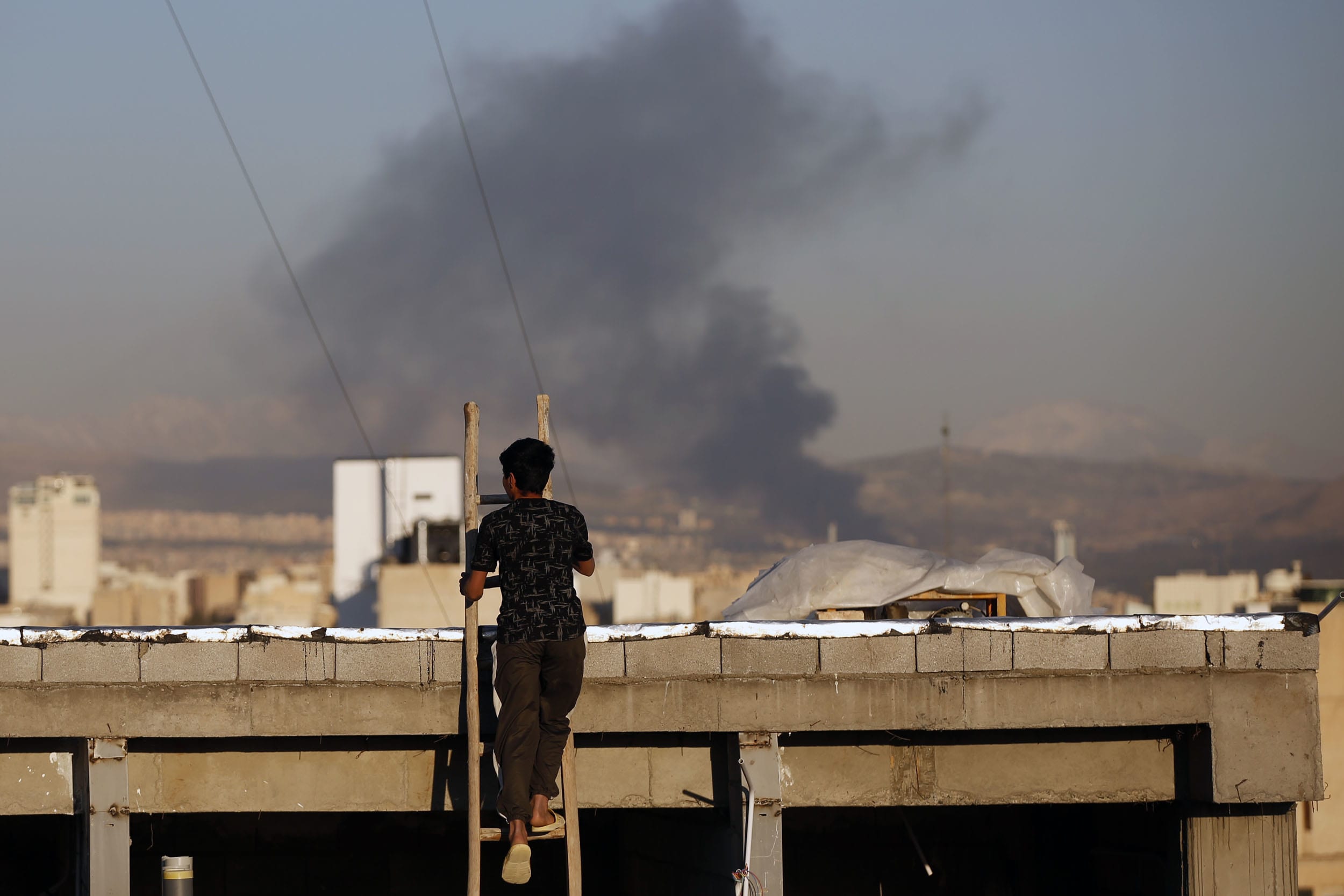 Smoke rises from east of Tehran following U.S. and Israeli strikes on on March 3, 2026.