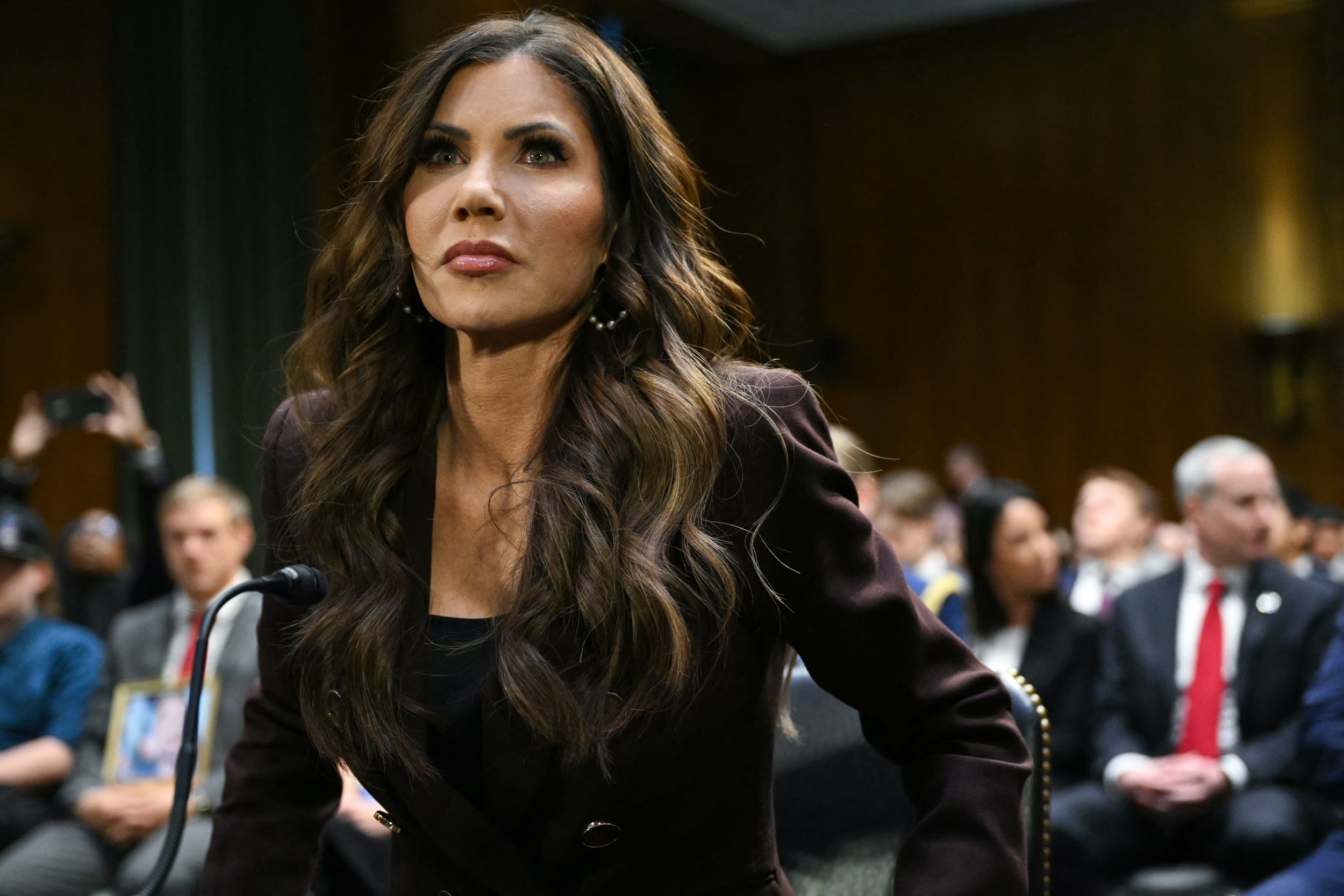 Homeland Security Secretary Kristi Noem takes her seat as she arrives to testify during a Senate Judiciary Committee hearing on March 3, 2026.