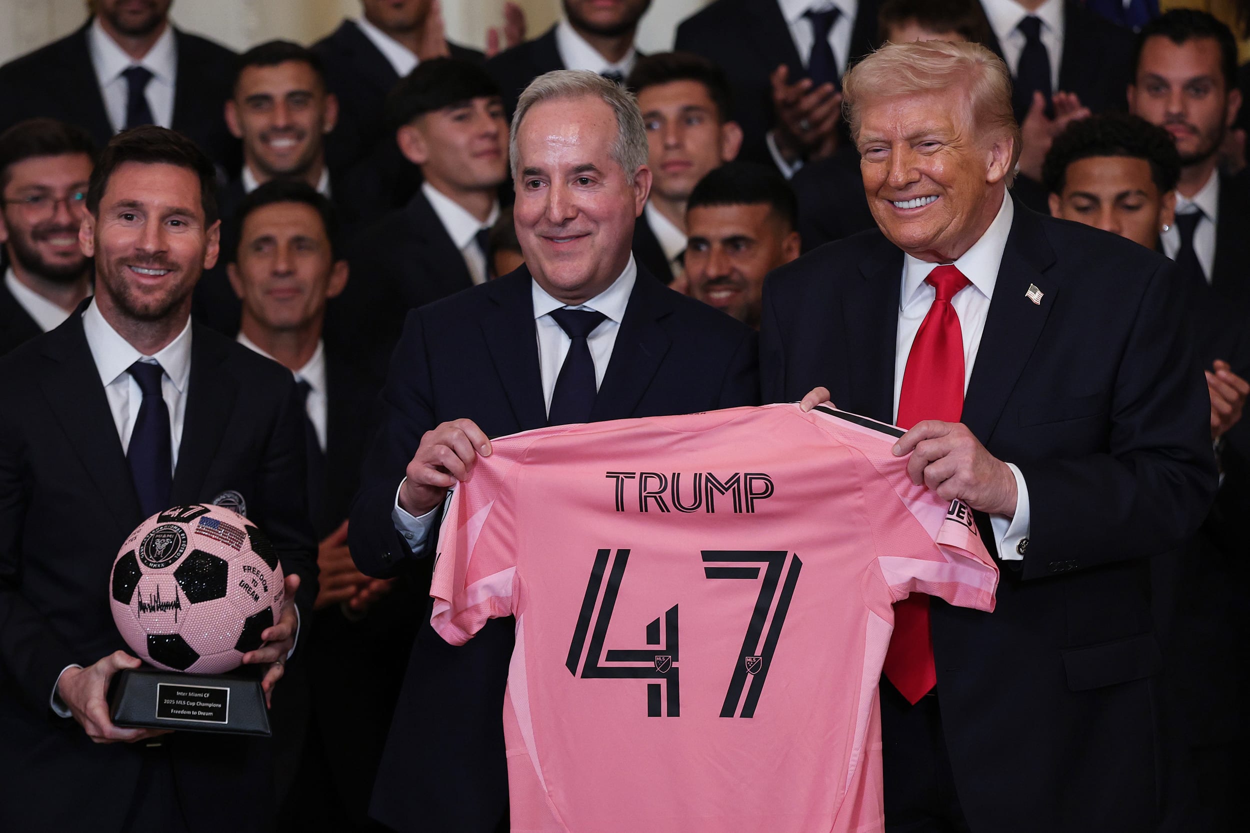 U.S. President Donald Trump poses with Inter Miami CF CEO and Managing Owner Jorge Mas (C) and Lionel Messi (L).