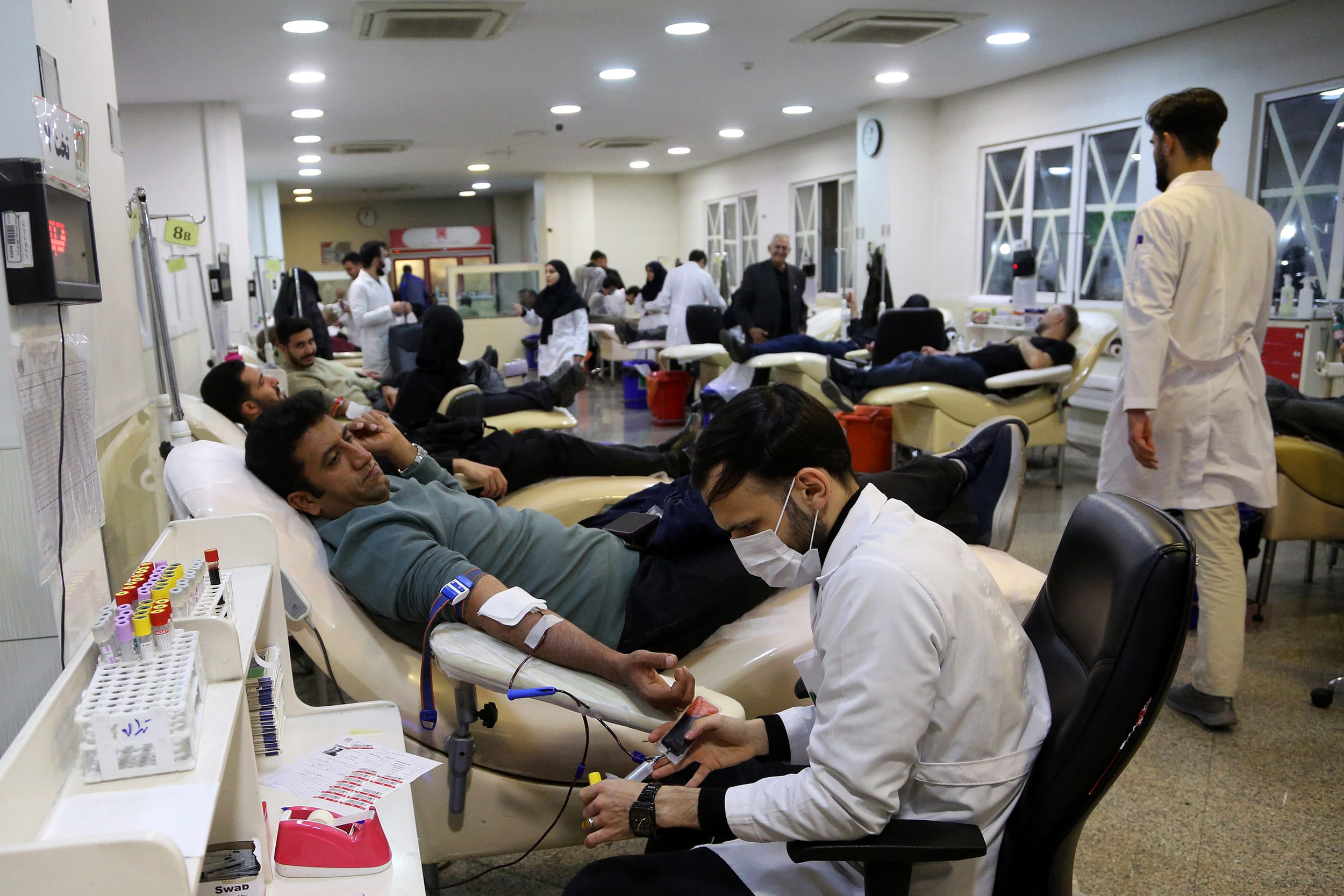 Iranians line up to donate blood for those injured in US-Israeli attacks on Iran