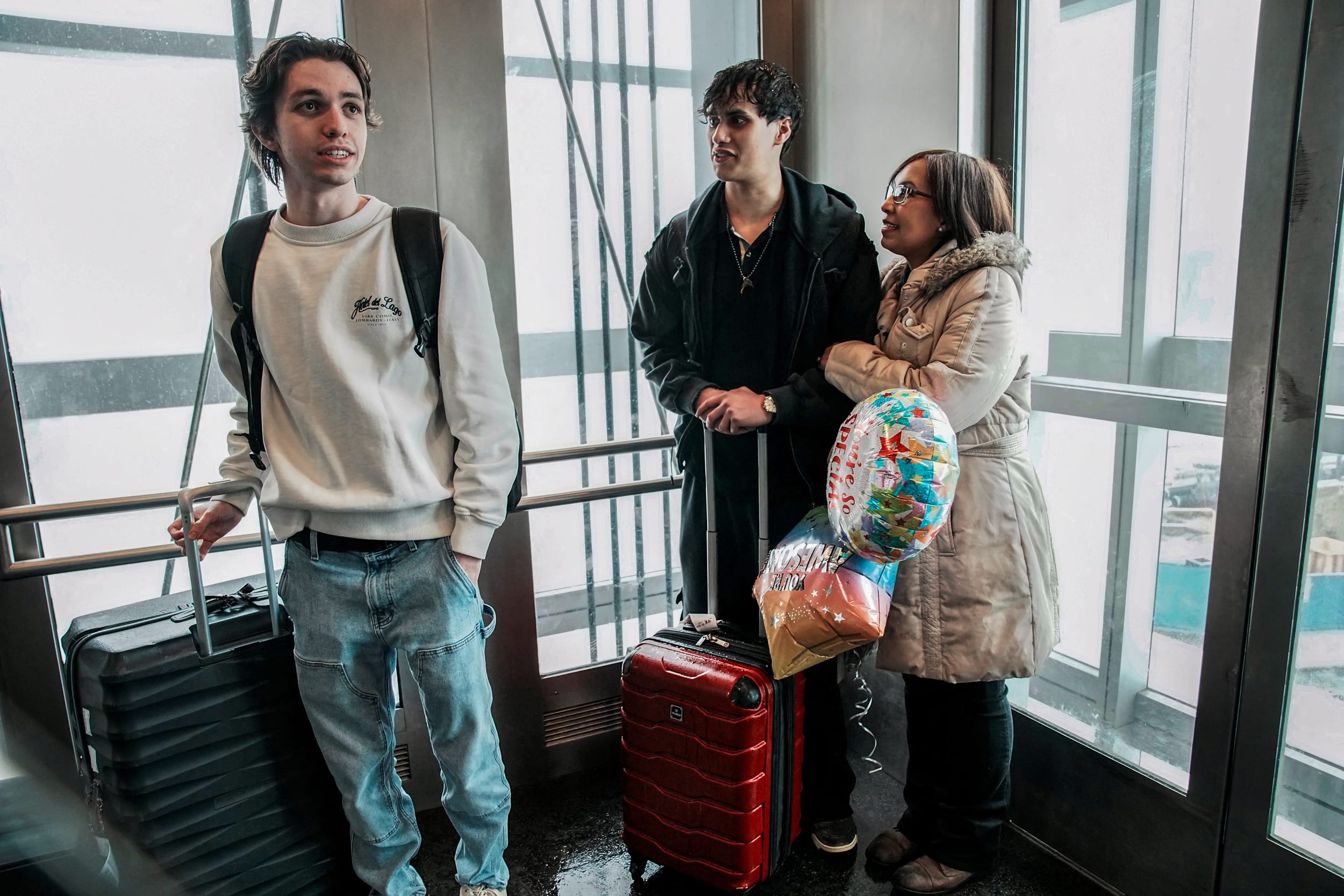 People arrive via U.S. government chartered flight at John F. Kennedy (JFK) International Airport in New York.
