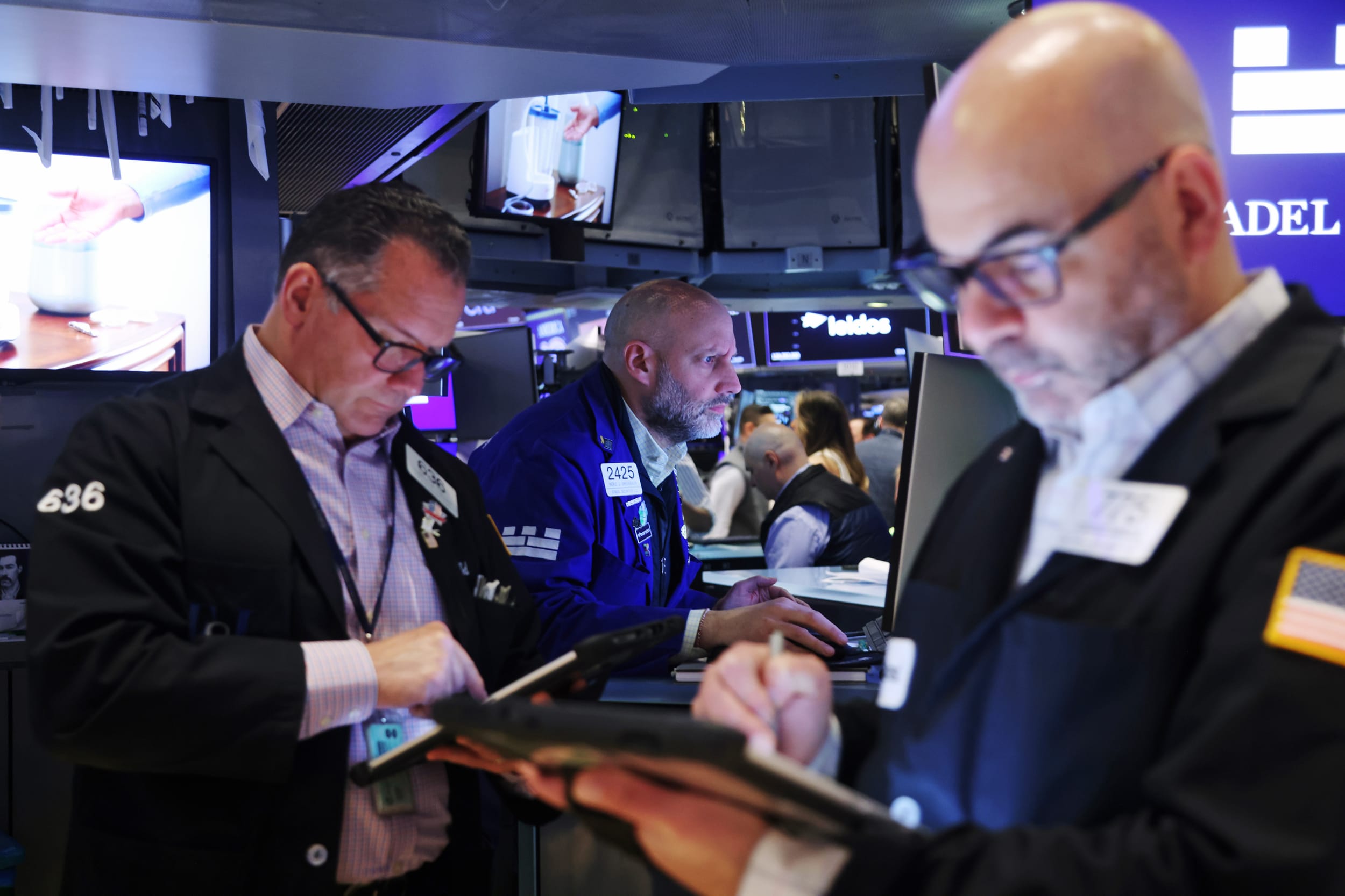 Traders work on the floor at the New York Stock Exchange on March 9, 2026. 