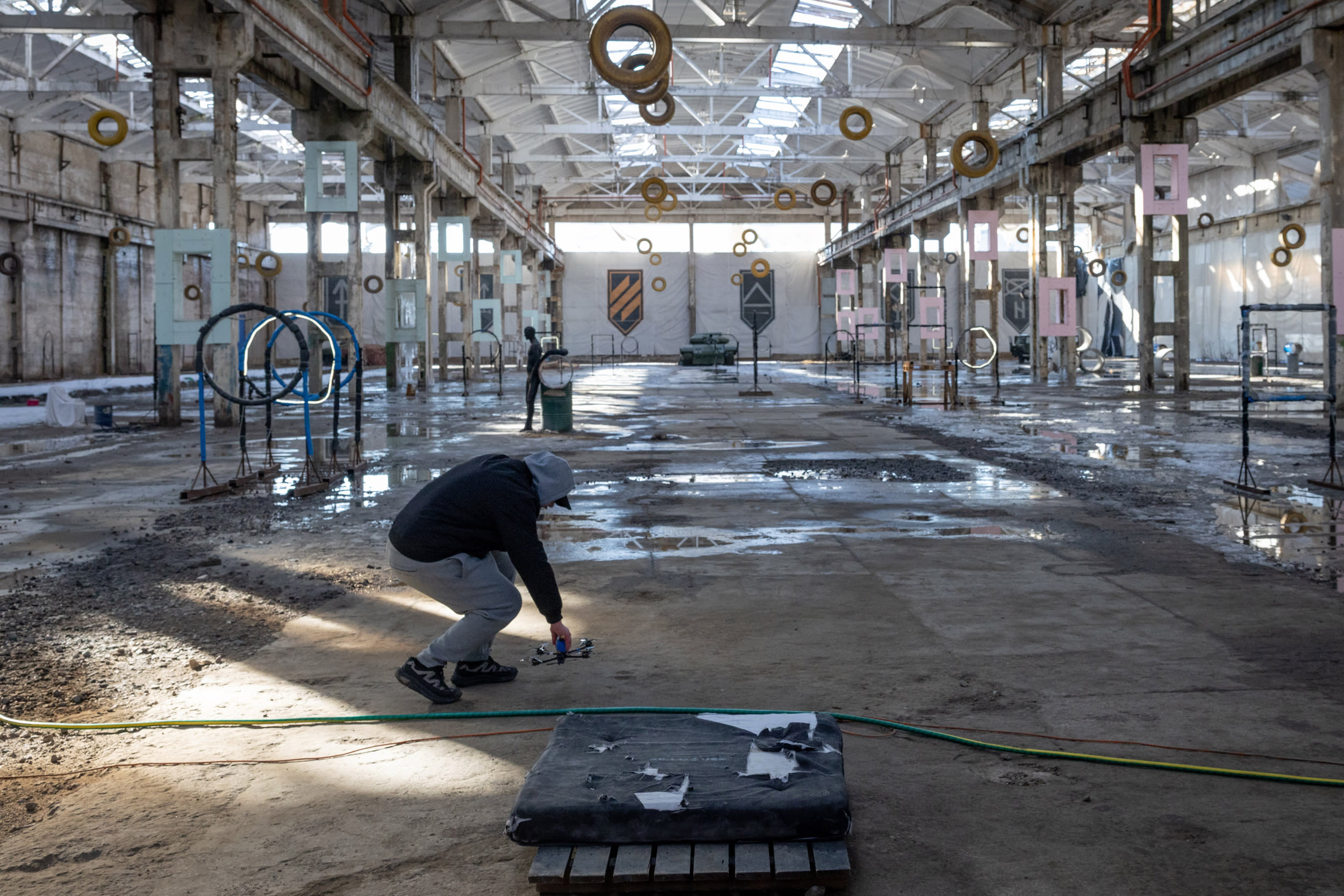 A man places a drone on a training obstacle course at the Killhouse Academy drone training center on March 4, 2026 in Kyiv, Ukraine. 