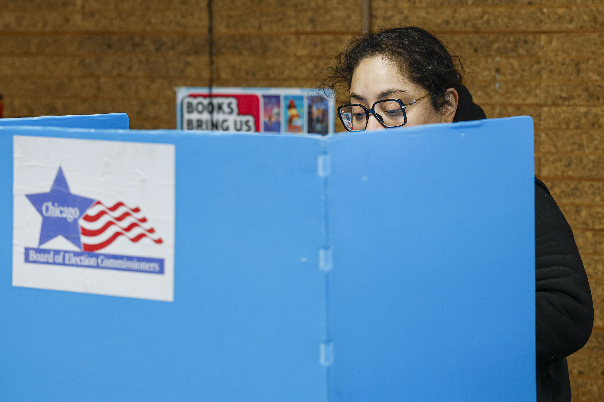 A woman casts her vote.
