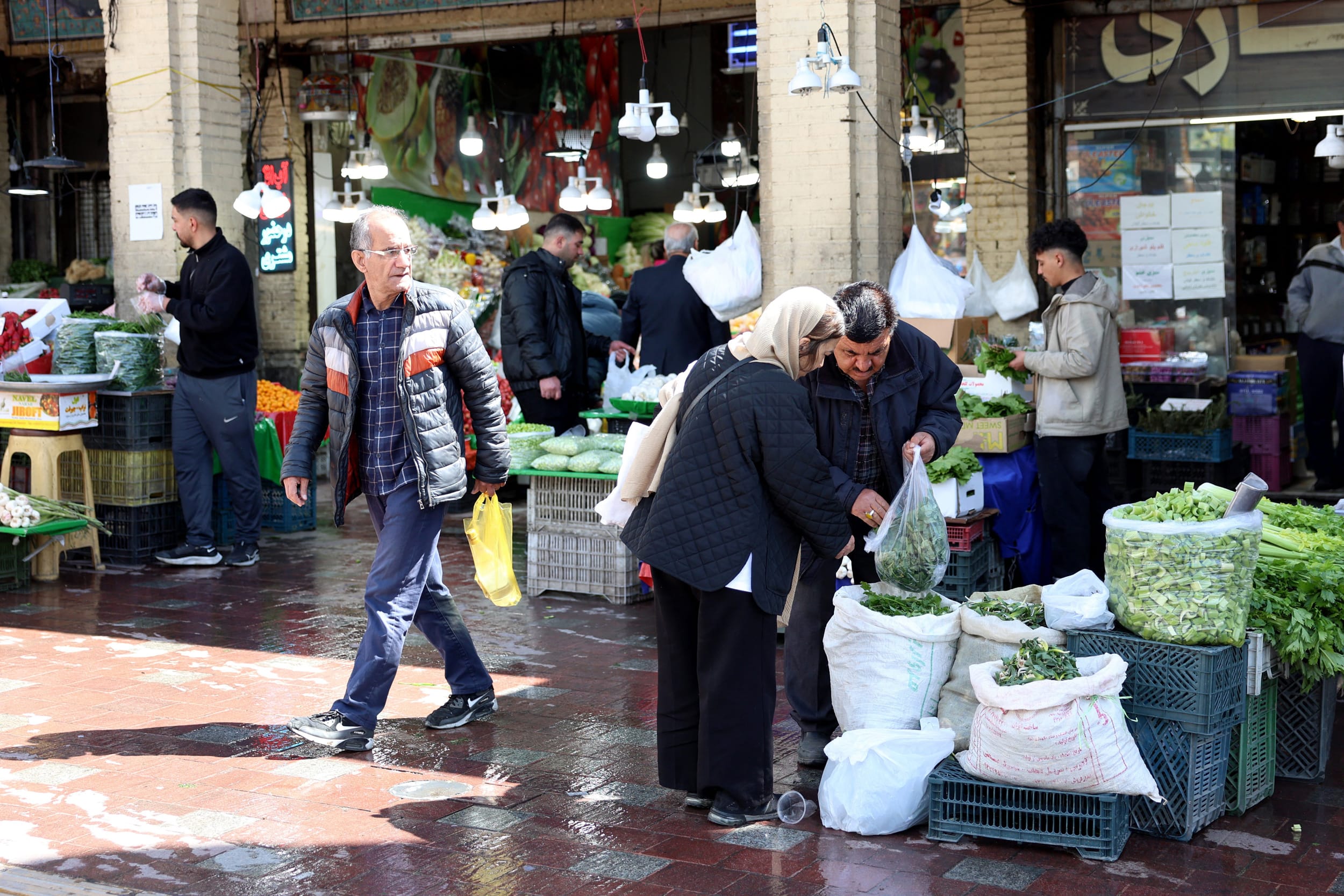Iranians shop at Tajrish Bazaar in Tehran on March 24, 2026. 