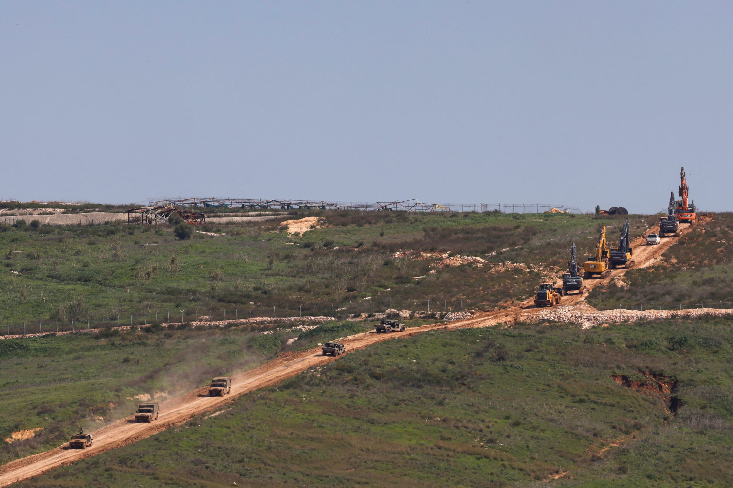 Heavy equipment and military vehicles cross from Israel into southern Lebanon on March 24, 2026.