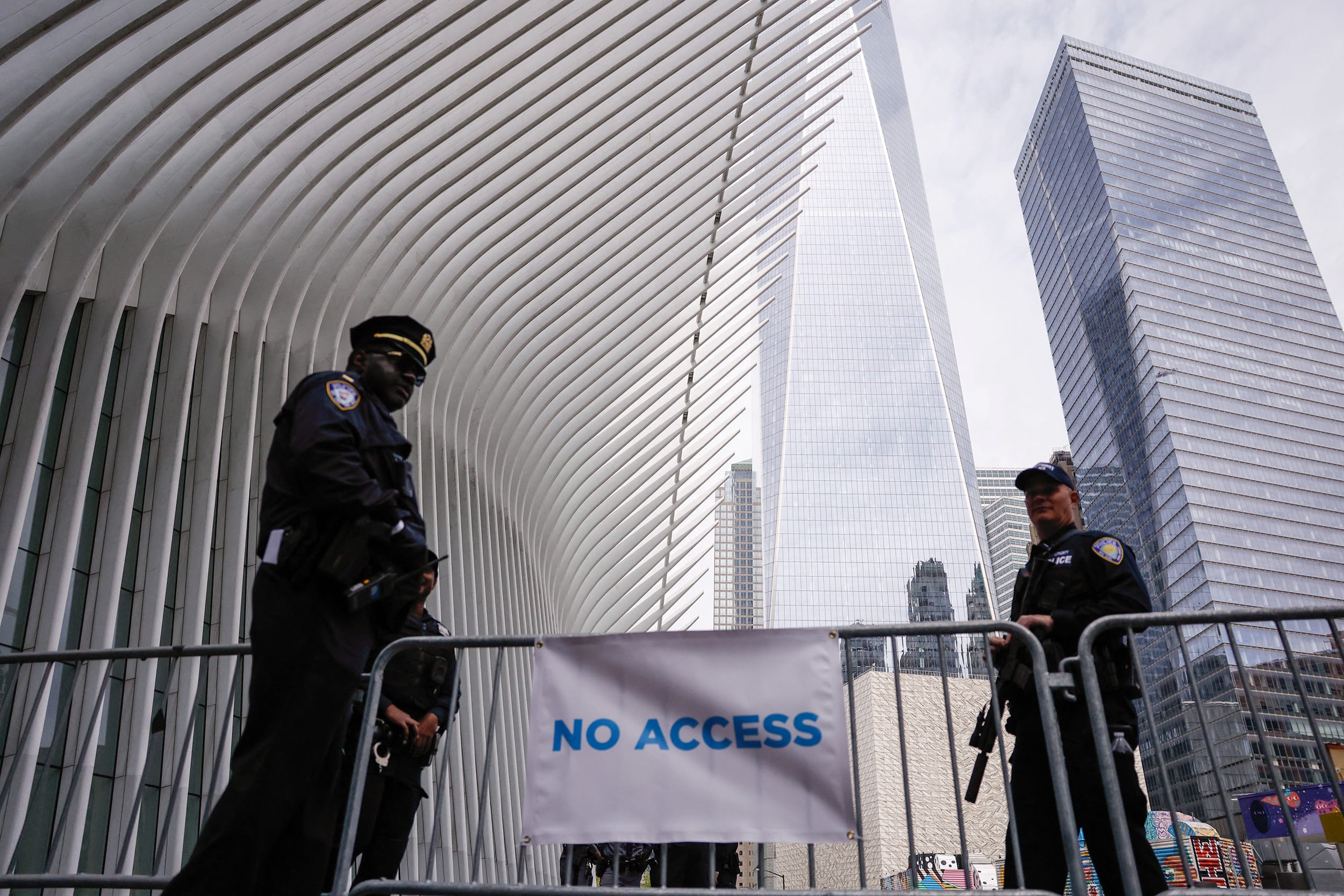 Police Officers stand guard at the Word Trade Center ahead of Britain's King Charles III and Queen Camilla's visit to the 9/11 Memorial in New York on April 29, 2026. 