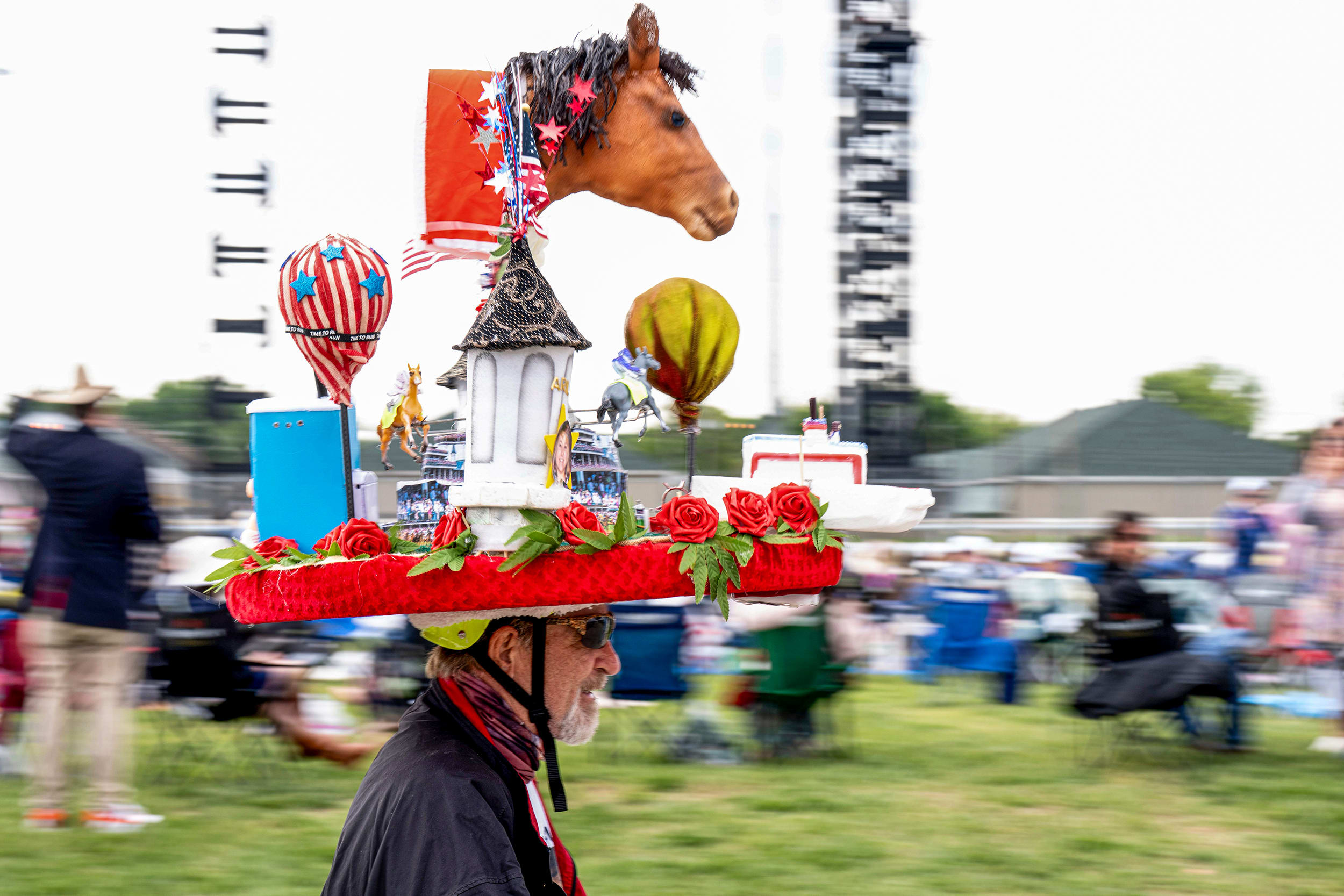 Tony Offutt wears a Kentucky Derby hat.