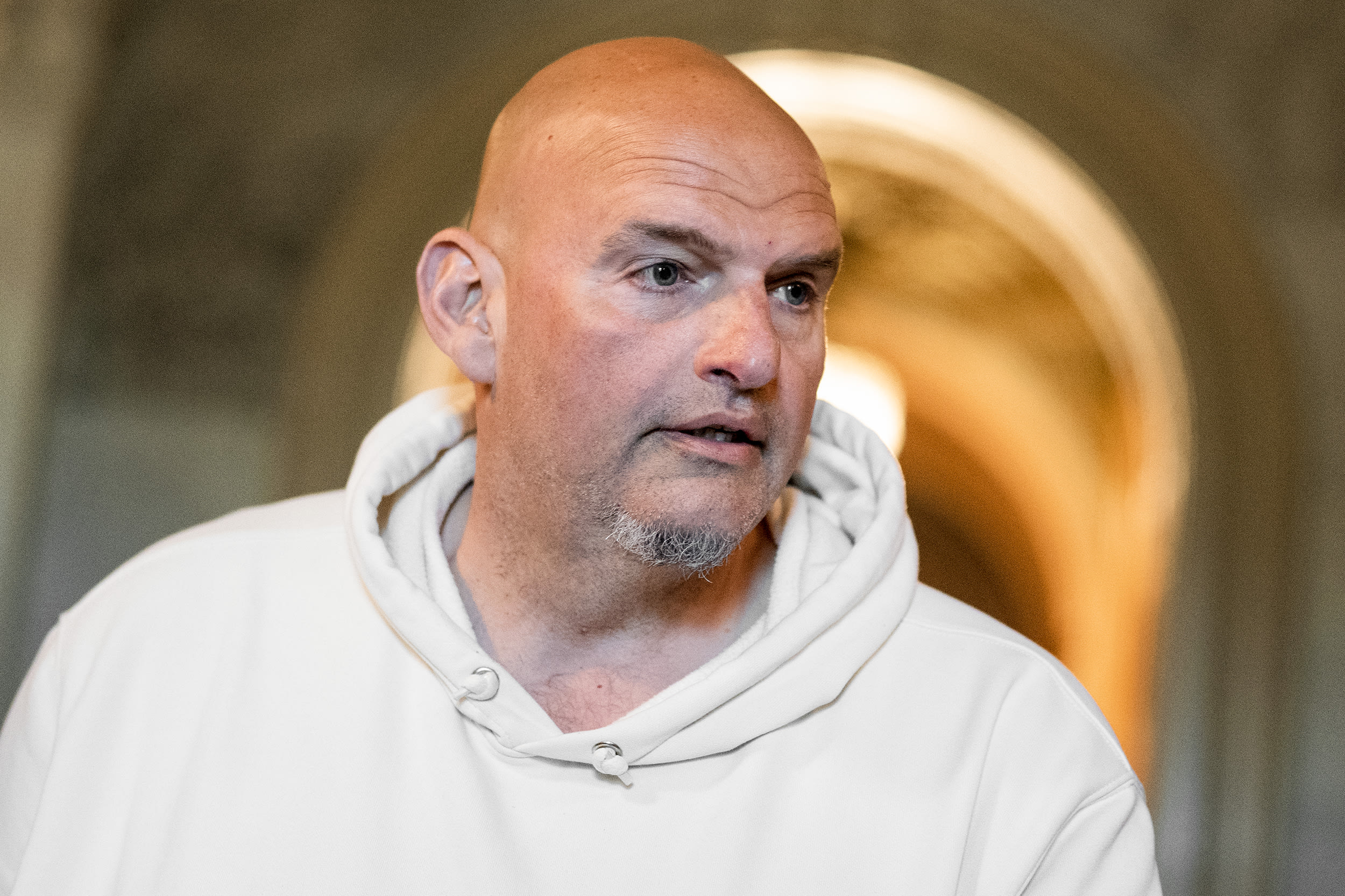 John Fetterman wearing a white hoodie inside the Capitol building.