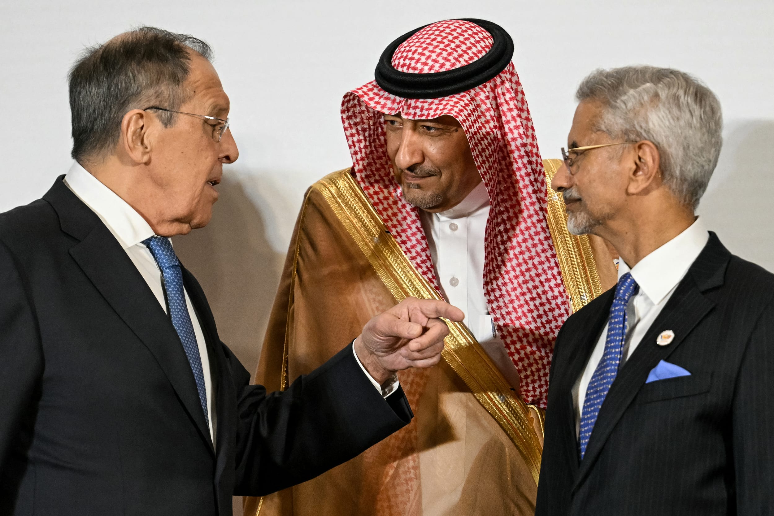 Russian Foreign Minister Sergey Lavrov, left, speaks with India's Foreign Minister Subrahmanyam Jaishankar and Saudi Arabia's Deputy Foreign Minister Waleed Al-Khuraiji 