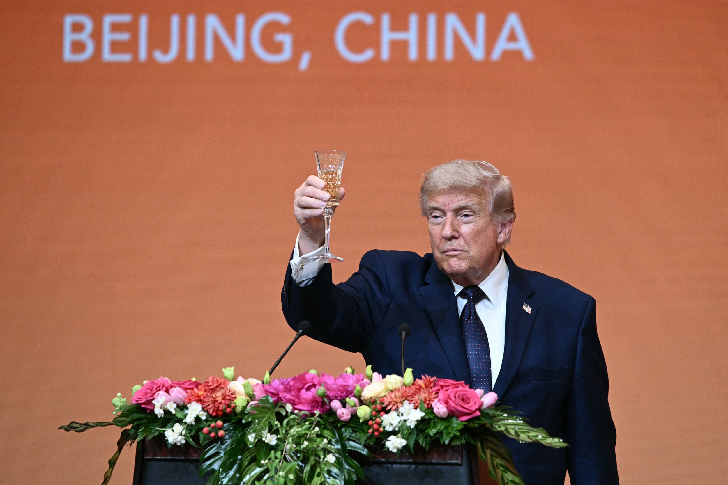 President Donald Trump makes a toast as he attends a state banquet with China's President Xi Jinping at the Great Hall of the People in Beijing on May 14, 2026.