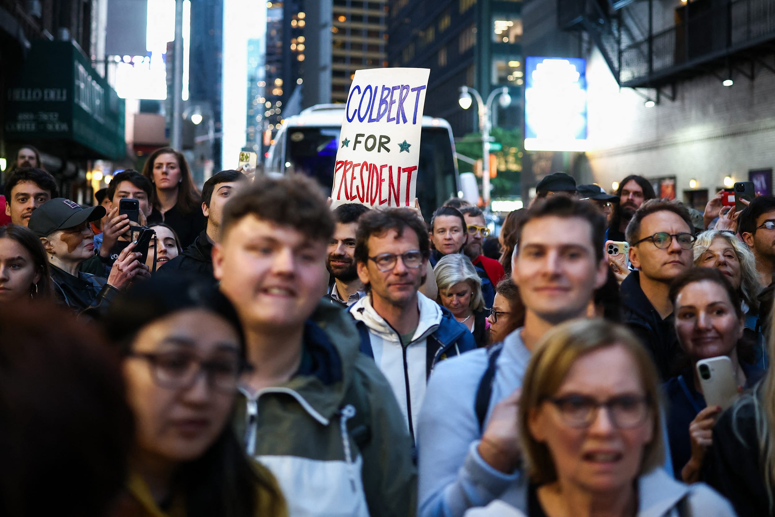 People wait in hopes to see Stephen Colbert outside the Ed Sullivan Theater 
