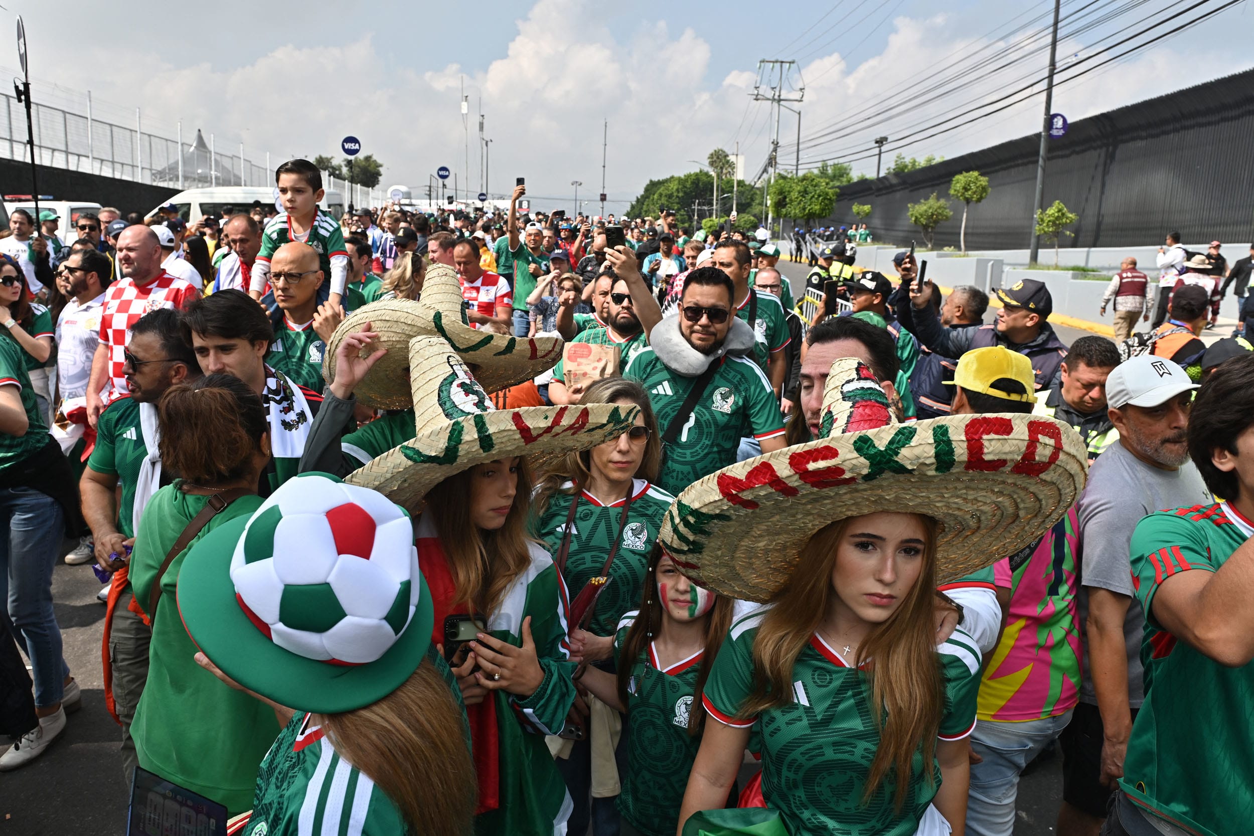 Mexico supporters gather outside the stadium
