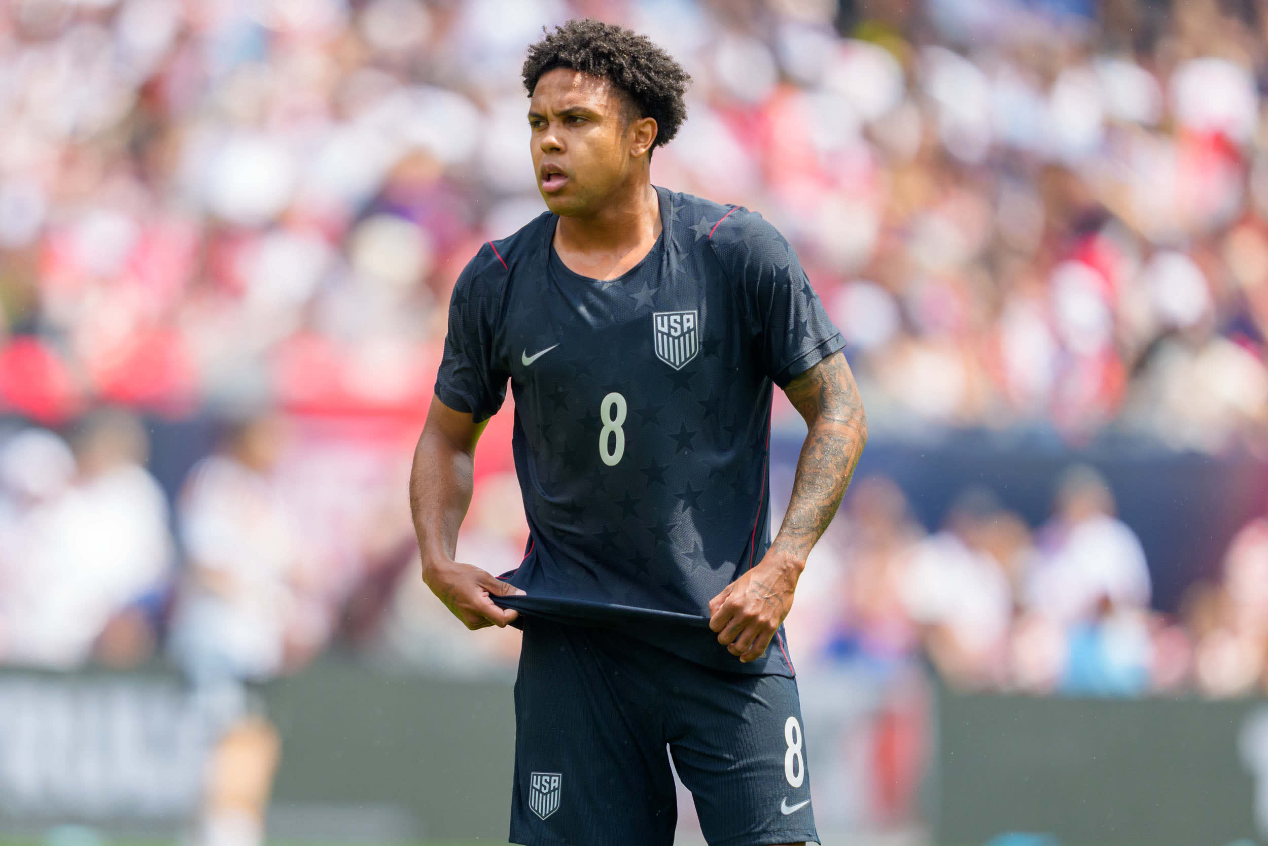 Weston Mckennie of the United States stands on the pitch 