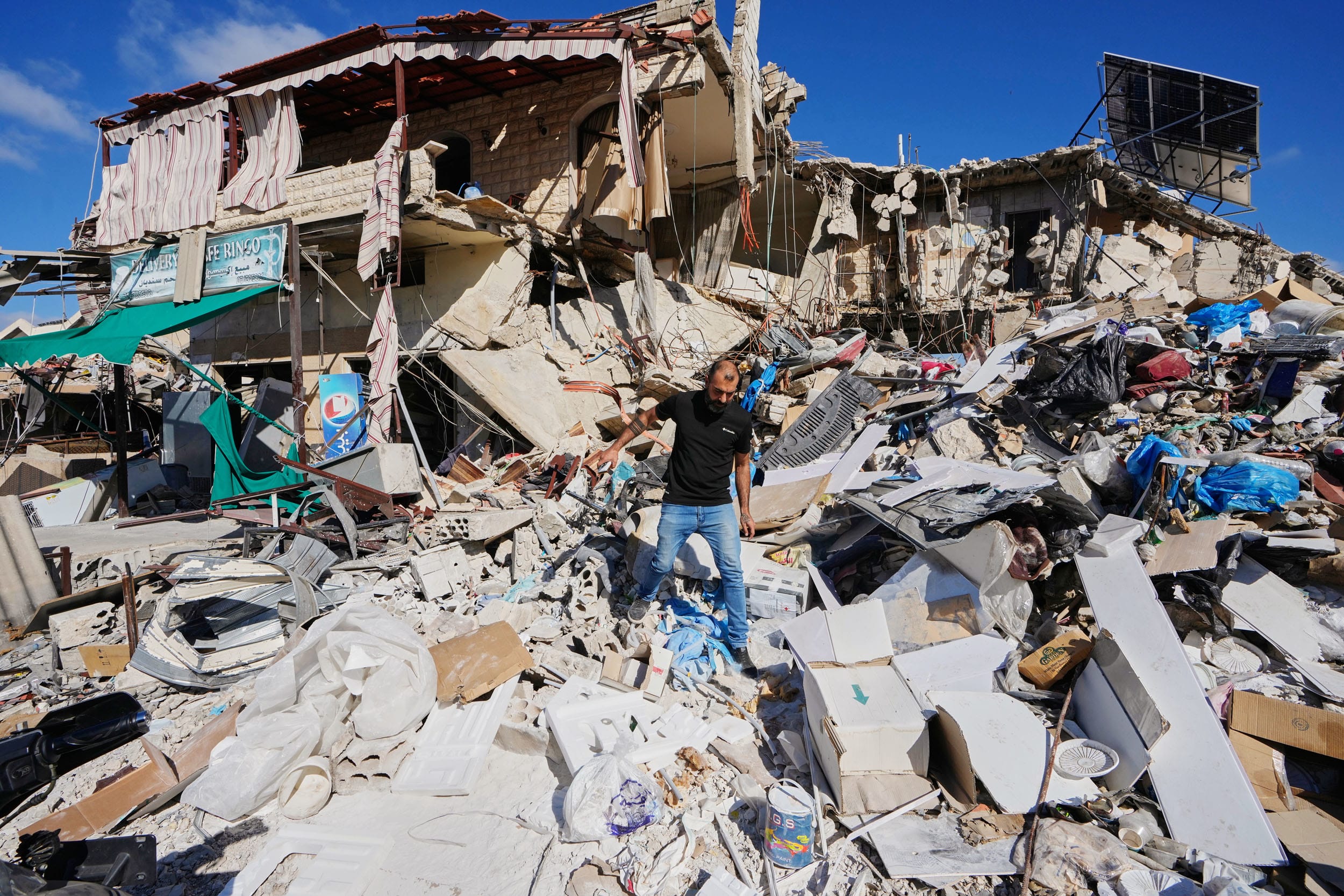 A man returning to his village following the announcement of an initial ceasefire agreement between the United States and Iran inspects his destroyed house in Tibnin, south Lebanon, Monday, June 15, 2026.