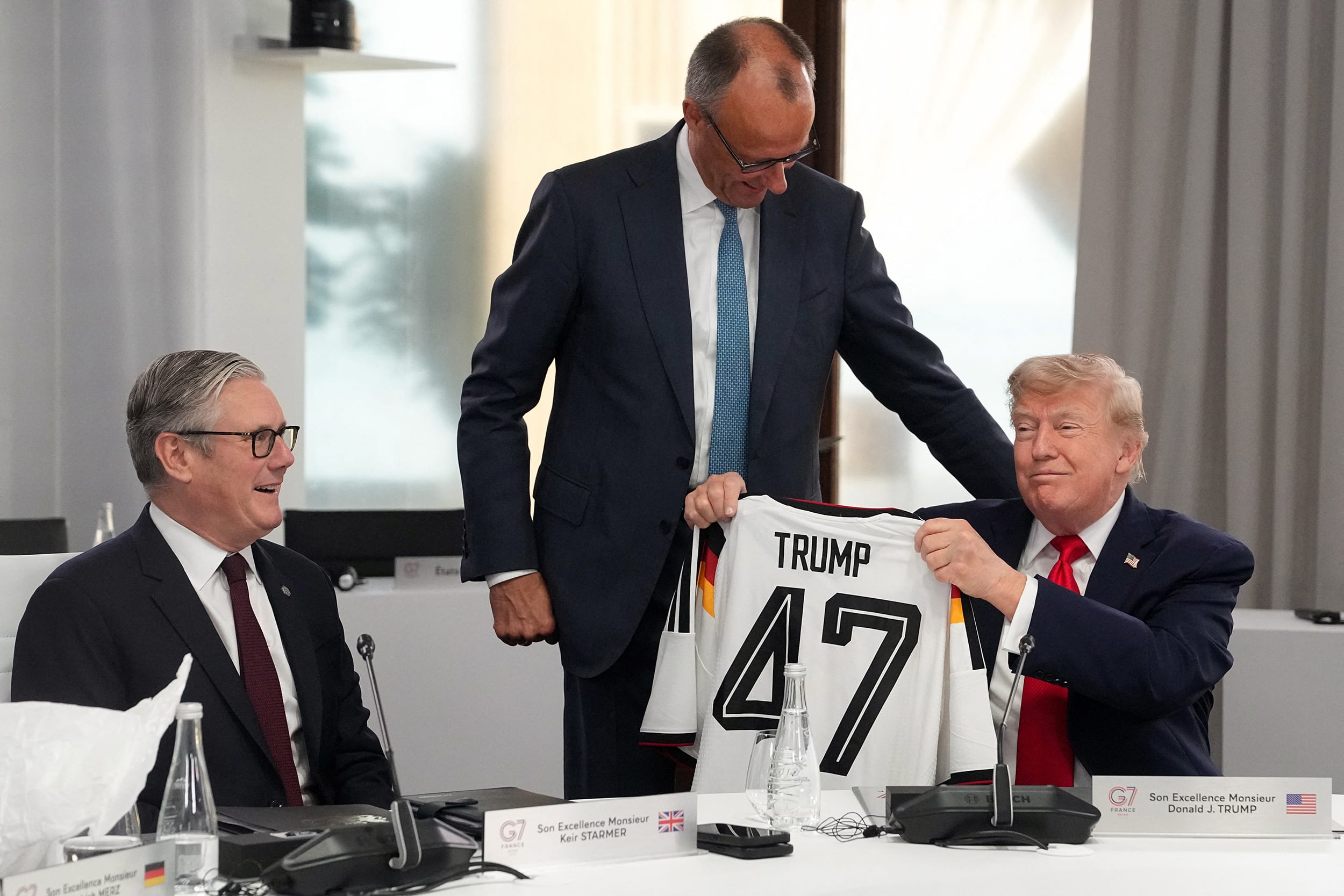 President Trump is gifted a 47 jersey by Germany's Chancellor Friedrich Merz at the G7 summit in Evian-les-Bains, France on June 16, 2026.