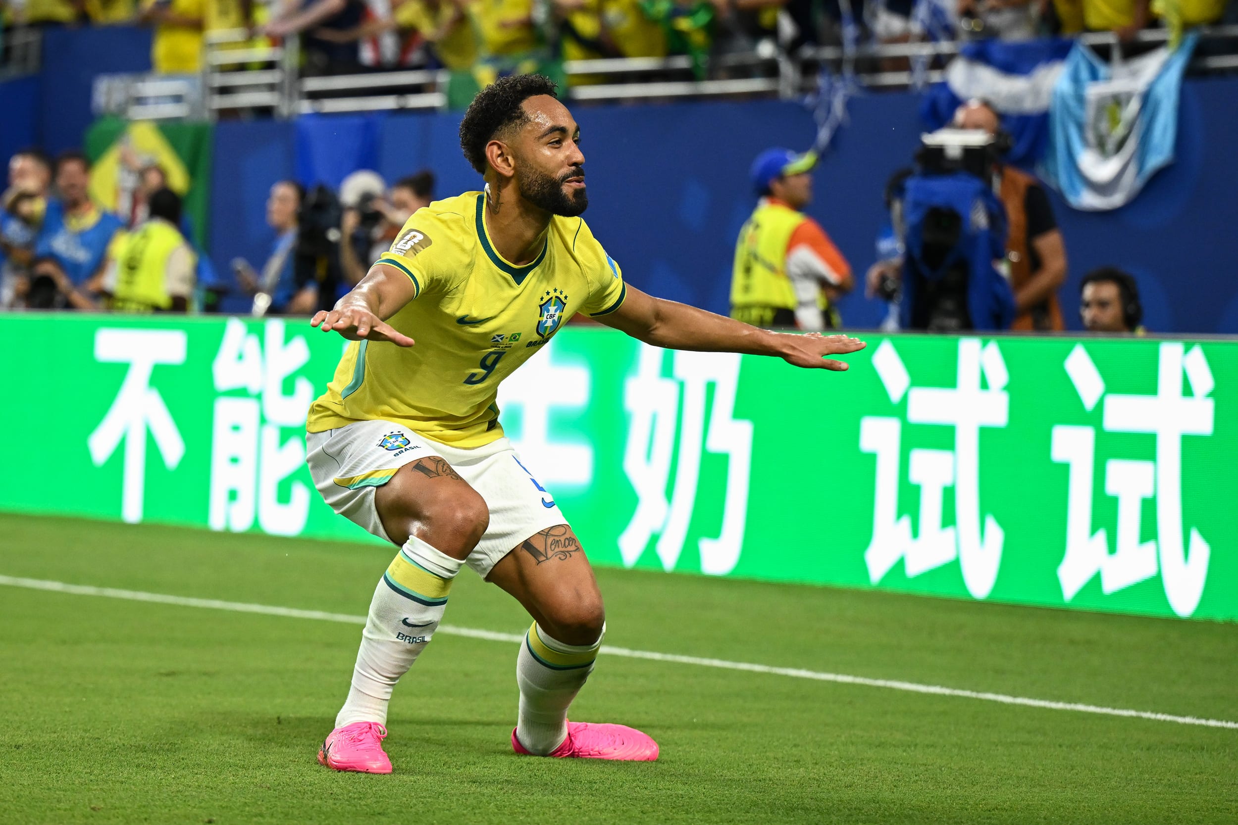 Matheus Cunha #9 of Brazil celebrates scoring his team's third goal.