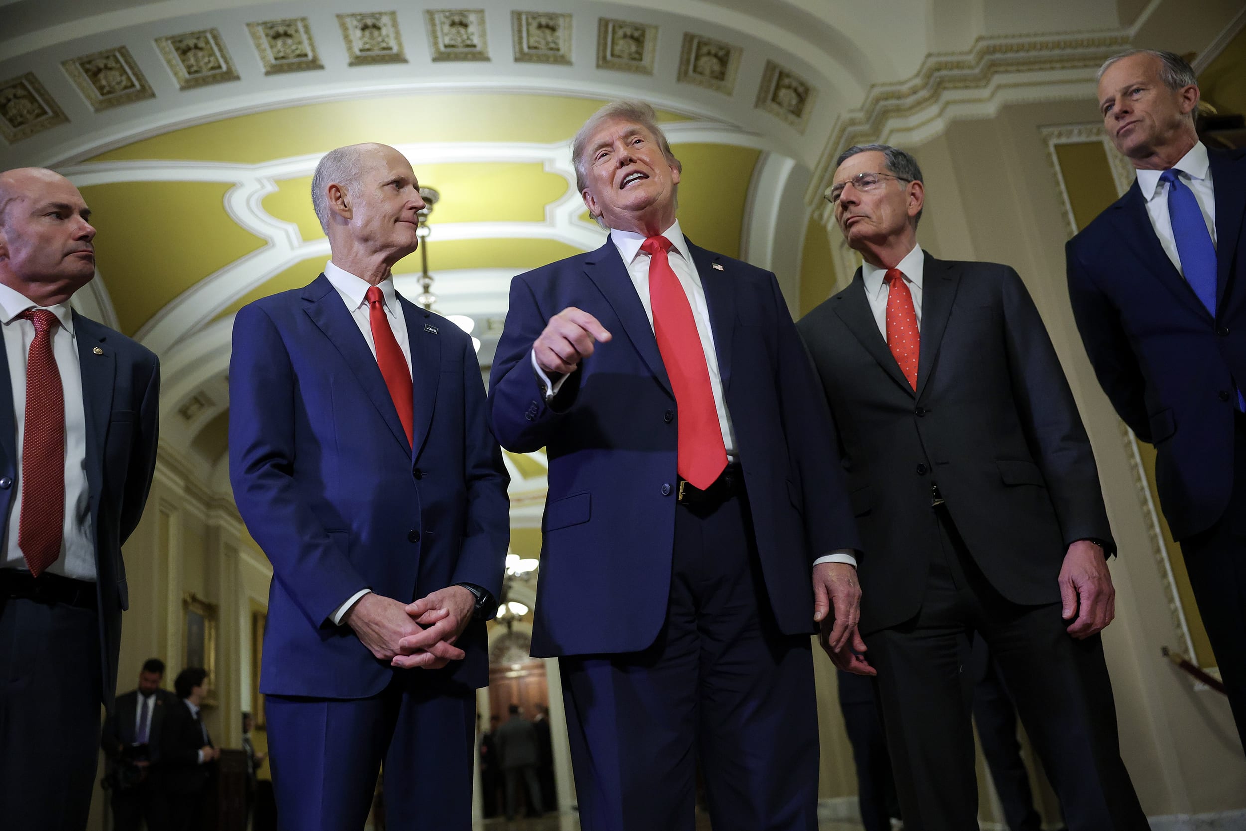 Donald Trump with four Republican Senators in the Capitol building.