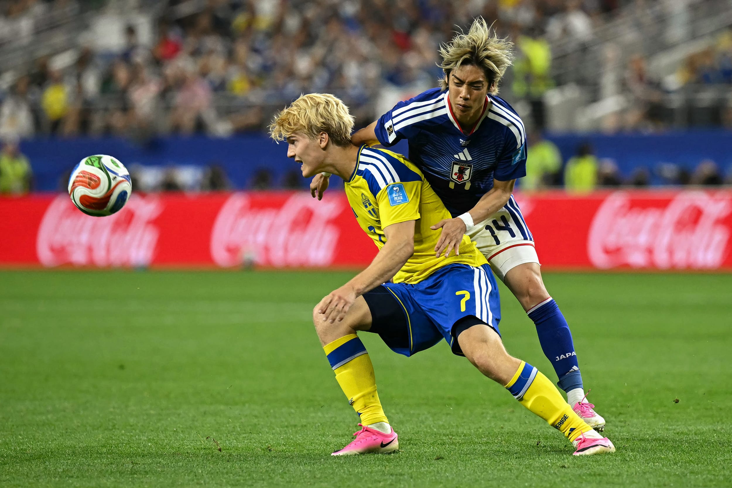 Sweden's midfielder #07 Lucas Bergvall and Japan's midfielder #14 Junya Ito.