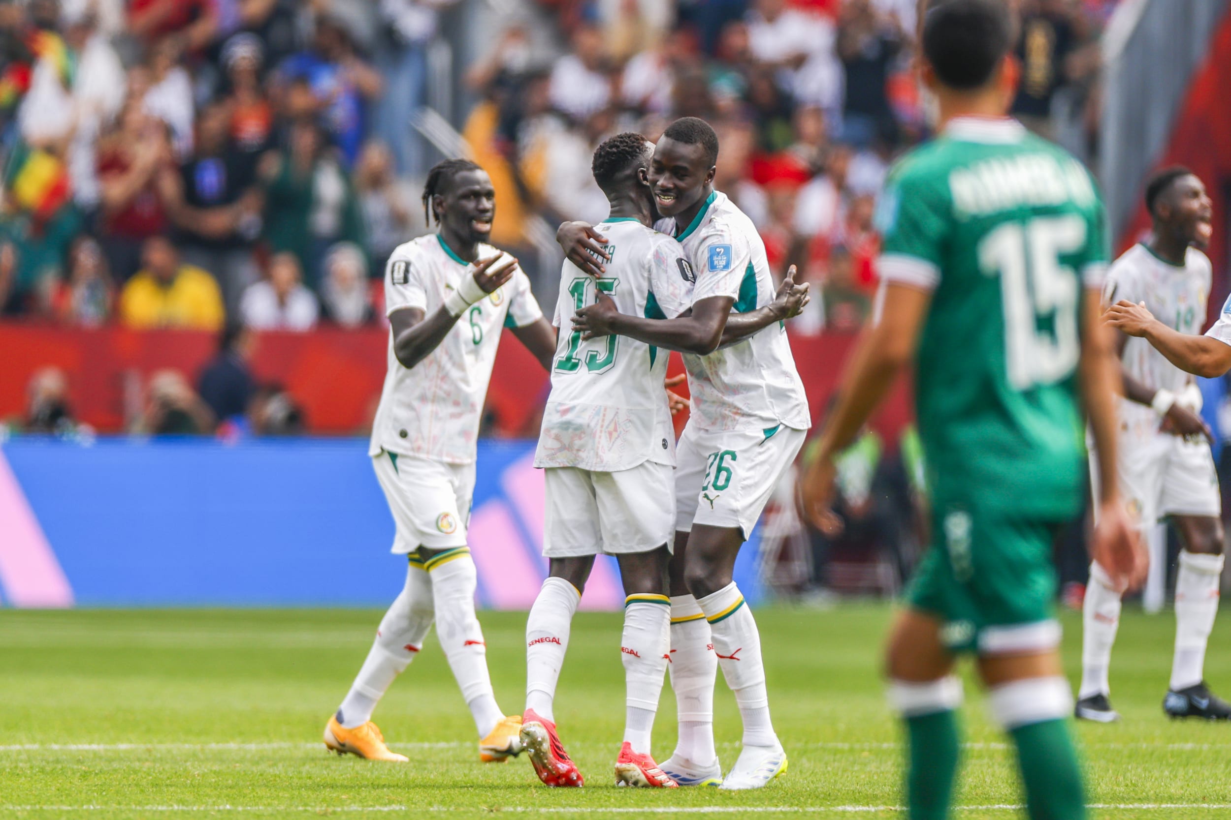 Papa Gueye #26 of Senegal celebrates his goal with teammates during Senegal v Iraq.