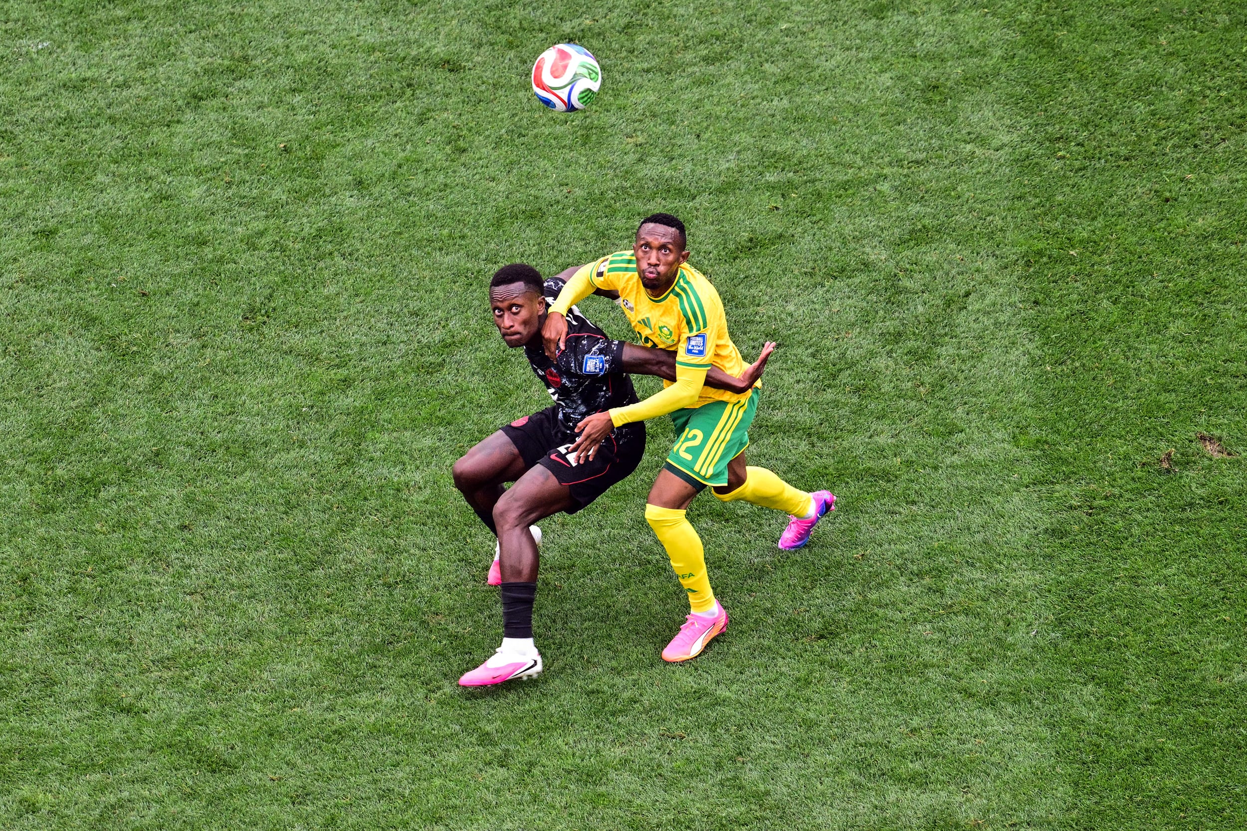 Canada's #22 Richie Laryea and South Africa's #12 Thapelo Maseko fight for the ball at the Los Angeles Stadium in Inglewood on June 28, 2026. 
