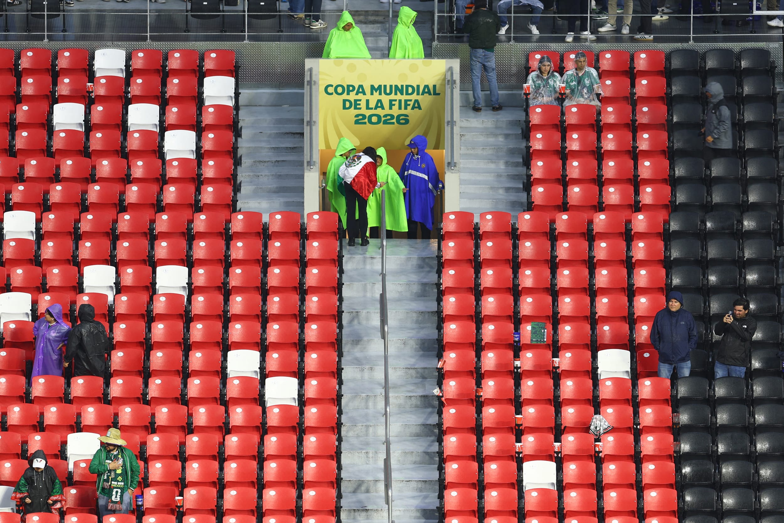 General view as fans wear rain ponchos inside the Estadio Azteca.