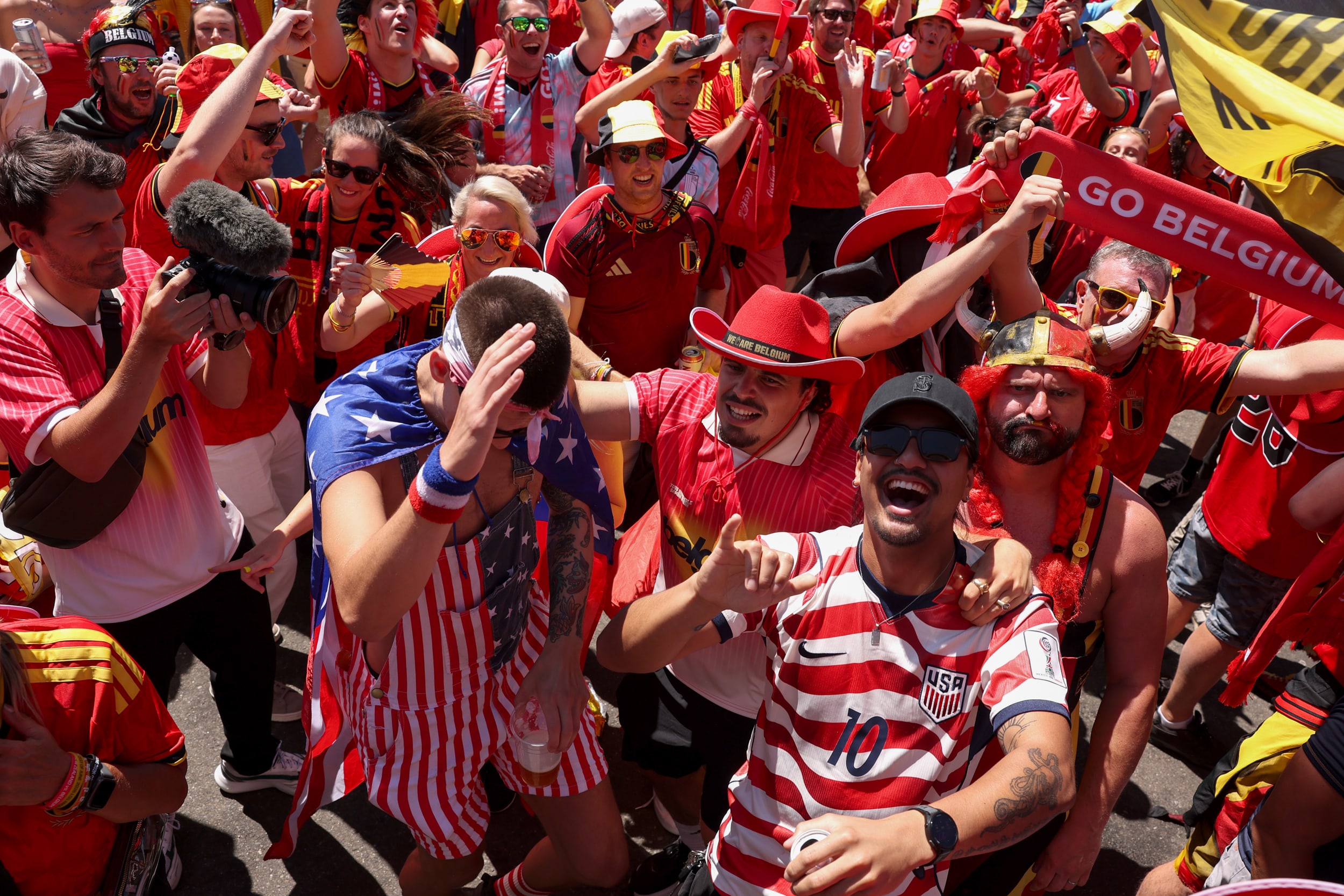 Fans of the United States enjoy the atmosphere with fans of Belgium before the US vs Belgium game.