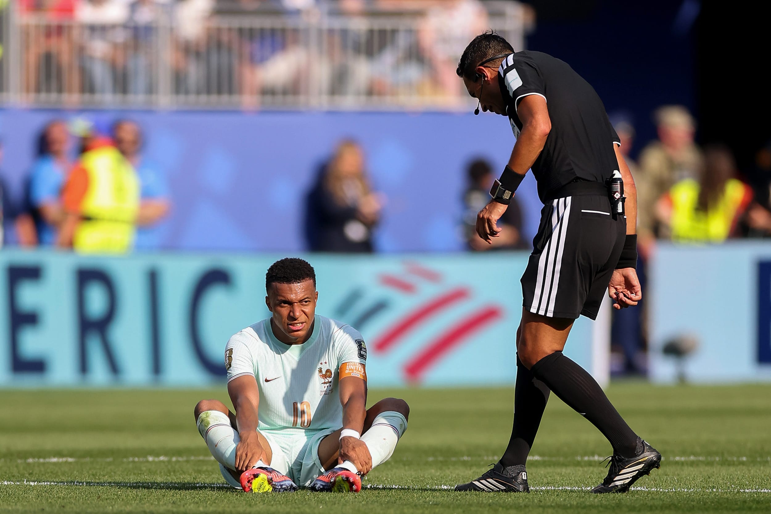 Kylian Mbappe #10 of France is attended to by referee during the France v Morocco: Quarter Final - FIFA World Cup 2026