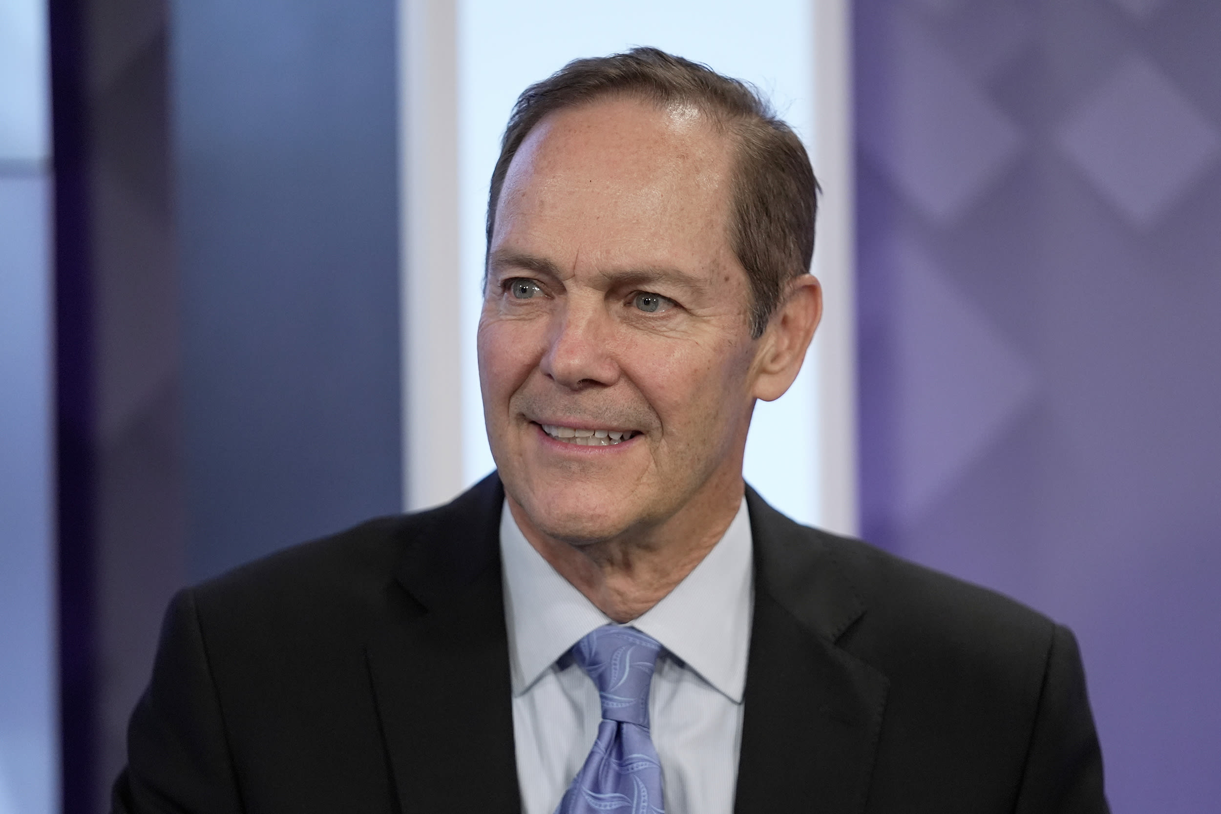 David Costello on stage during a televised debate.