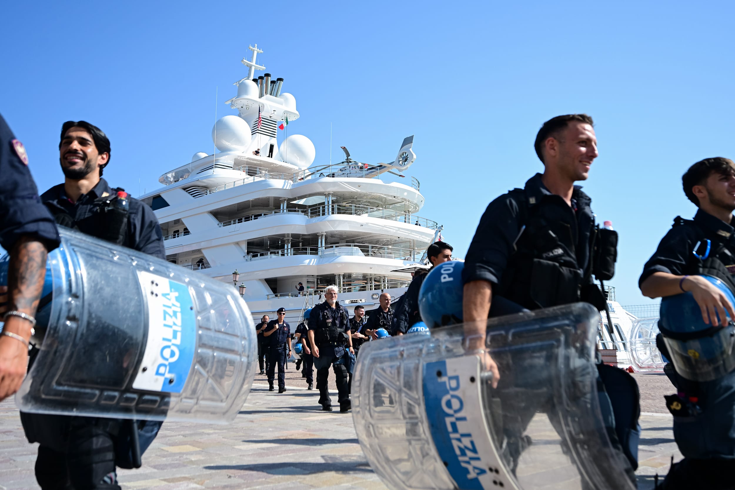 Police officers in front of US Ambassador to Italy Tilman Fertittas's megayacht.