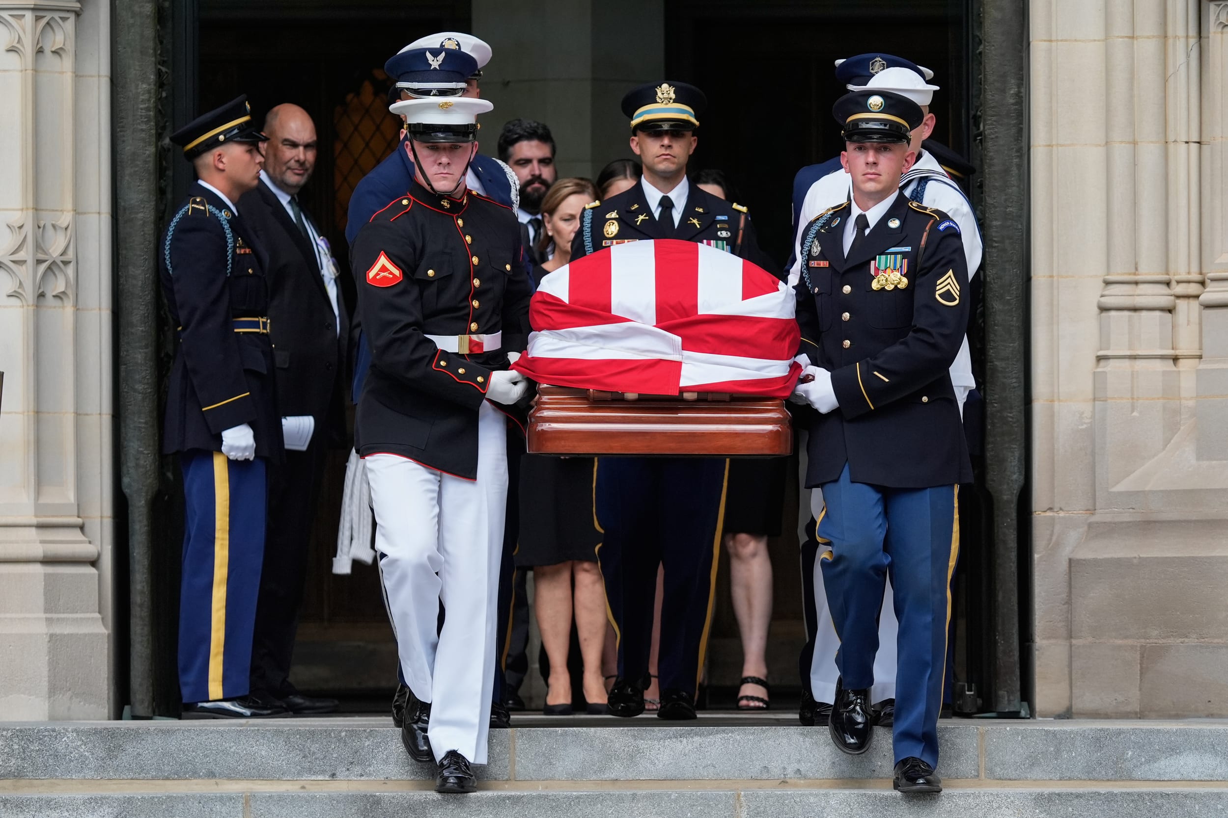 An Armed Forces Body Bearer Team carries the casket of the late Sen. Lindsey Graham, R-S.C., out of the Washington National Cathedral, in Washington D.C.