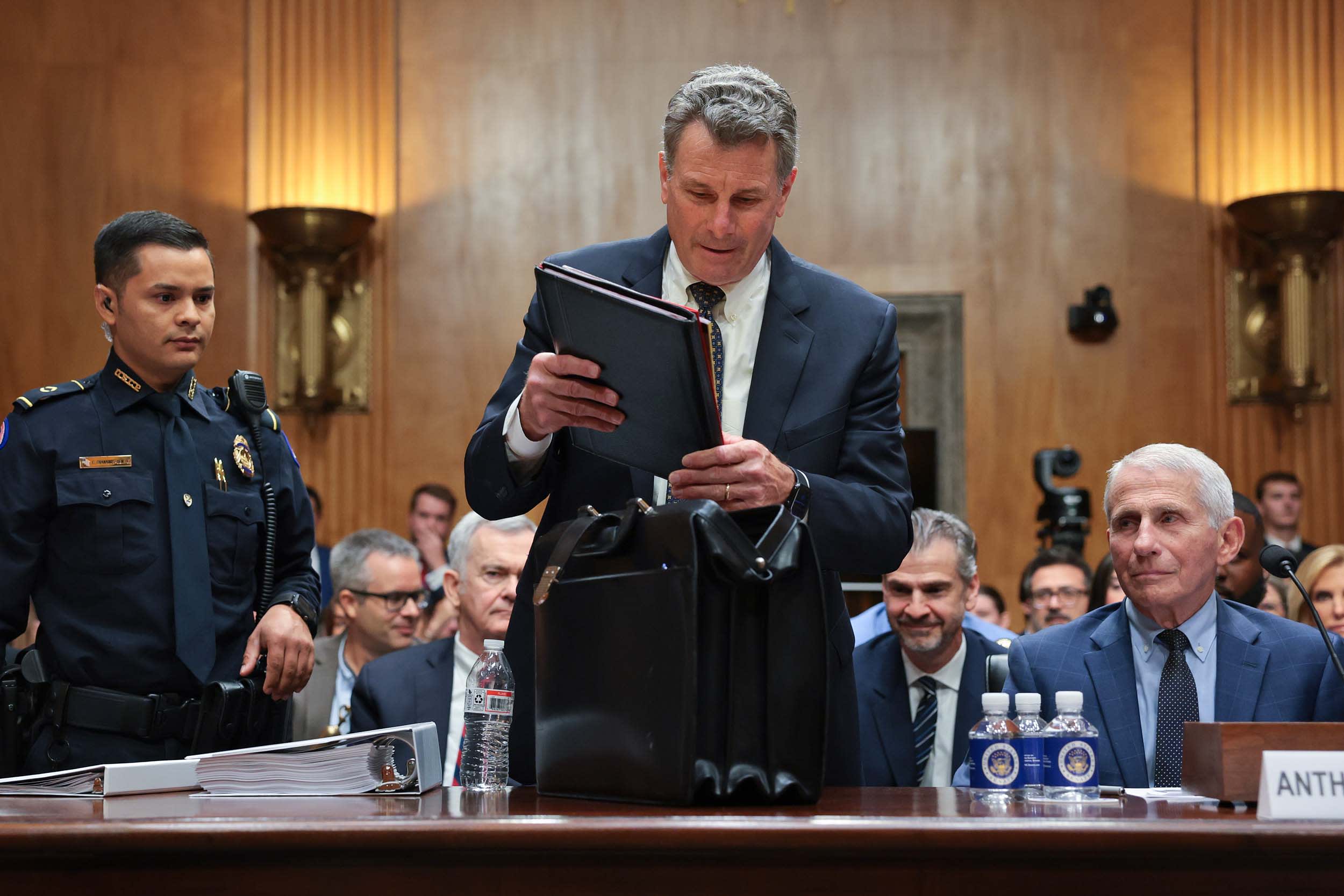 David Schertler, the attorney for former NIH Director Anthony Fauci, is removed from the hearing room at the direction of committee chairman Sen. Rand Paul on July 29, 2026.