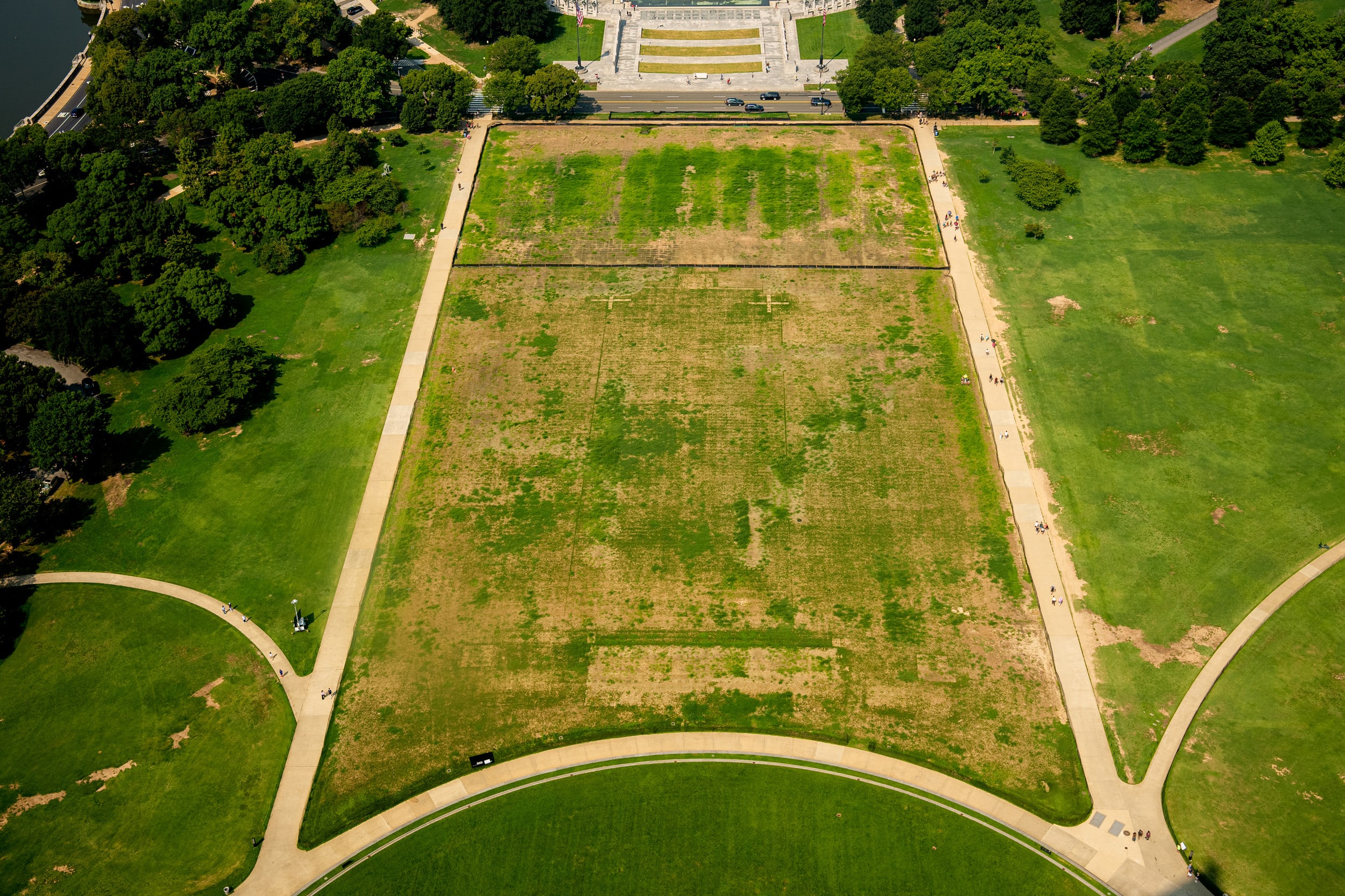 The grass near the World War II Memorial where the Freedom 250 Salute to America event was held is seen from the Washington Monument on August 10, 2026.