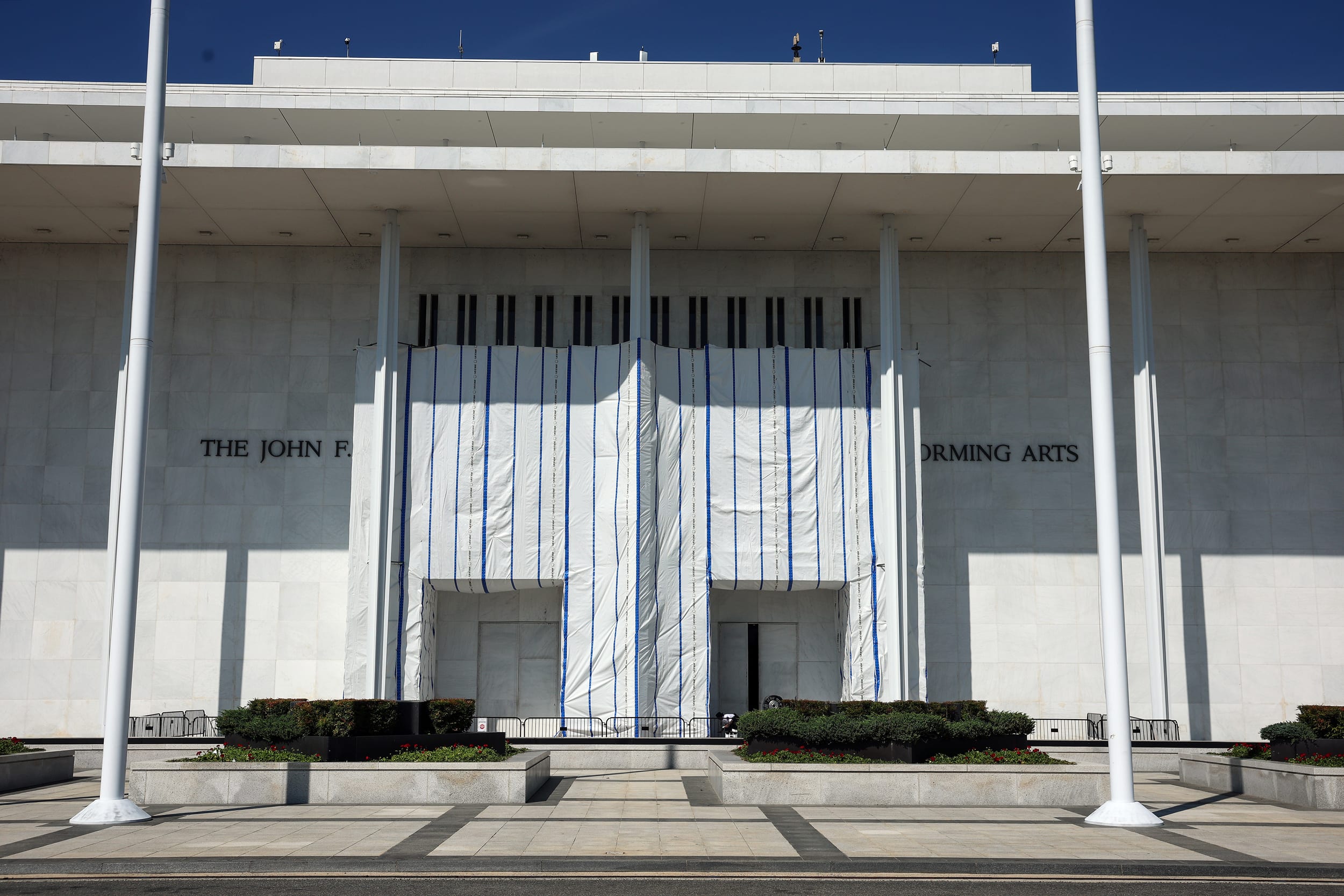 Tarp covering the sign at Kennedy Center