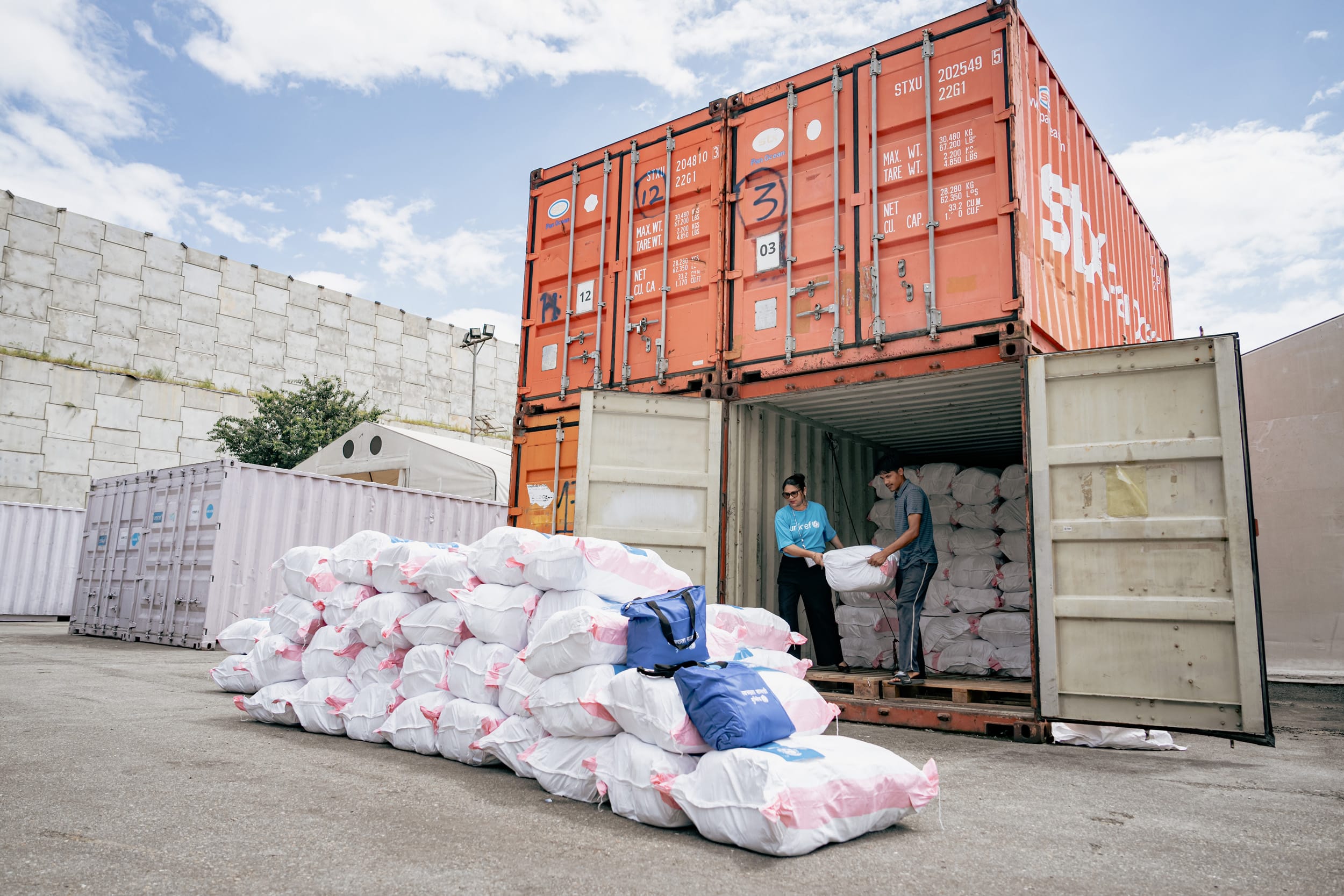 UNICEF staff prepare hygiene kits the airport in Kathmandu, Nepal, for delivery to flood-affected communities.