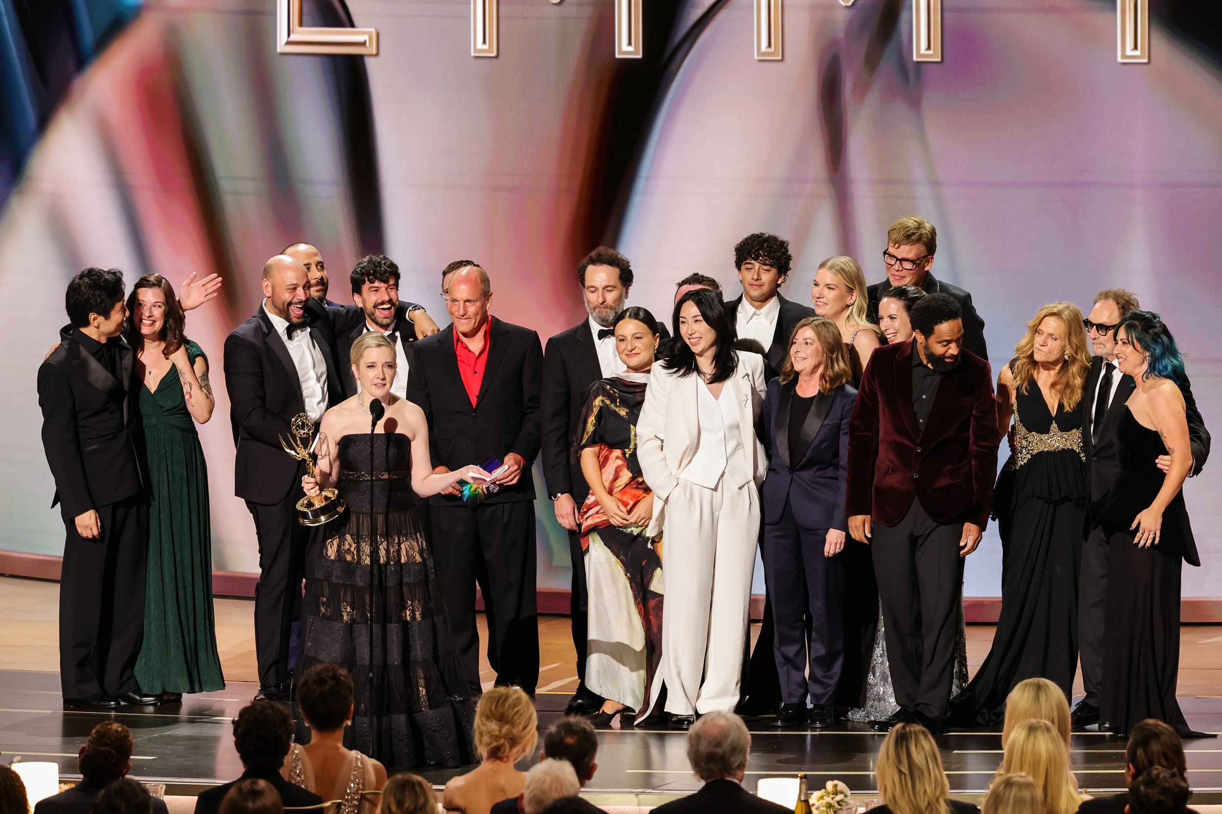Katie Dippold and cast/crew accept an Emmy Award.