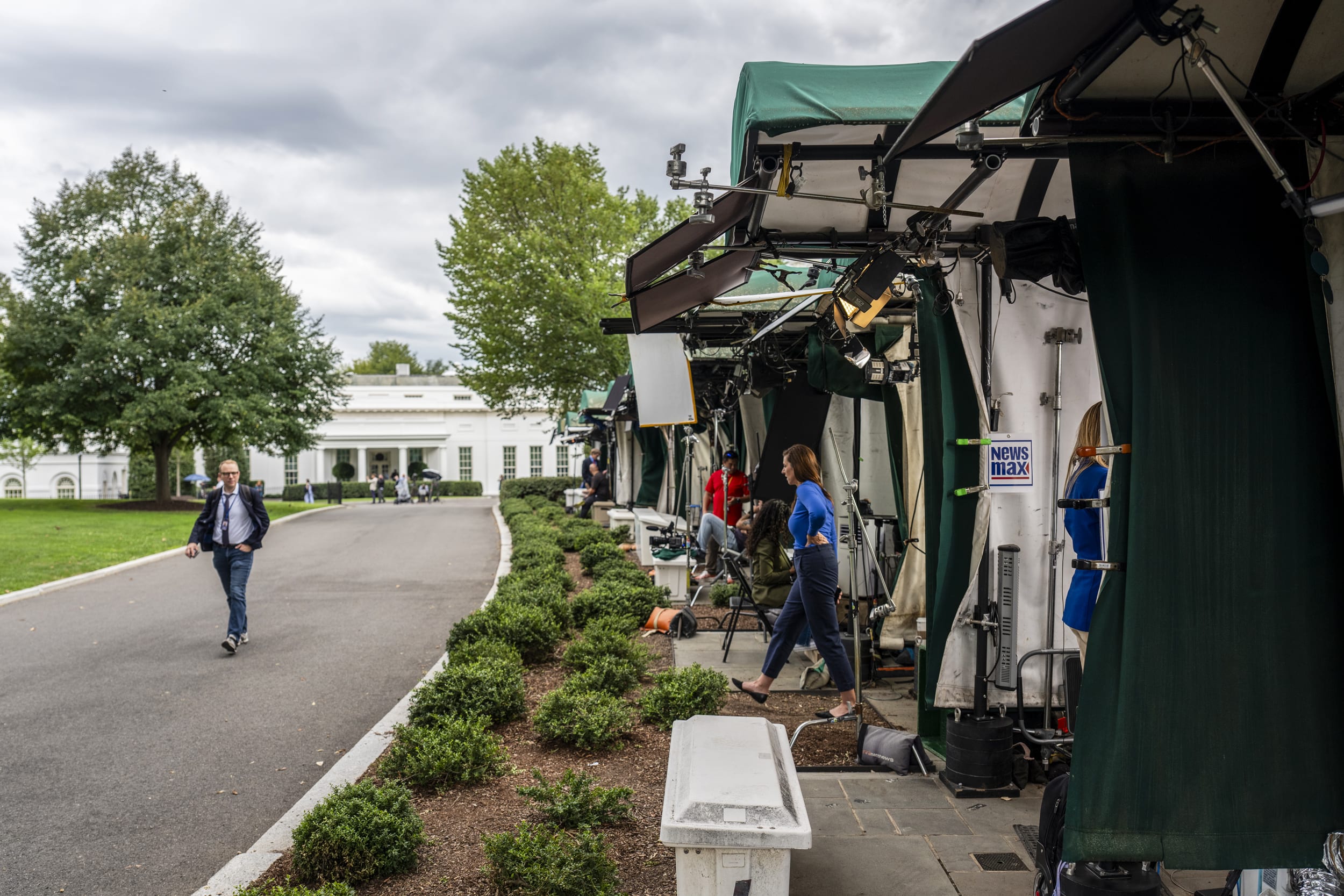 A person walks near the area known as 'Pebble Beach' in the White House.