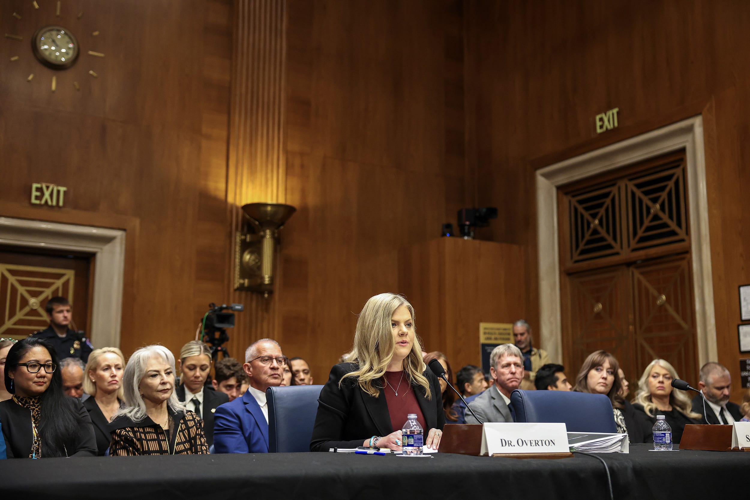 Heidi Overton seated while testifying in a Senate hearing.