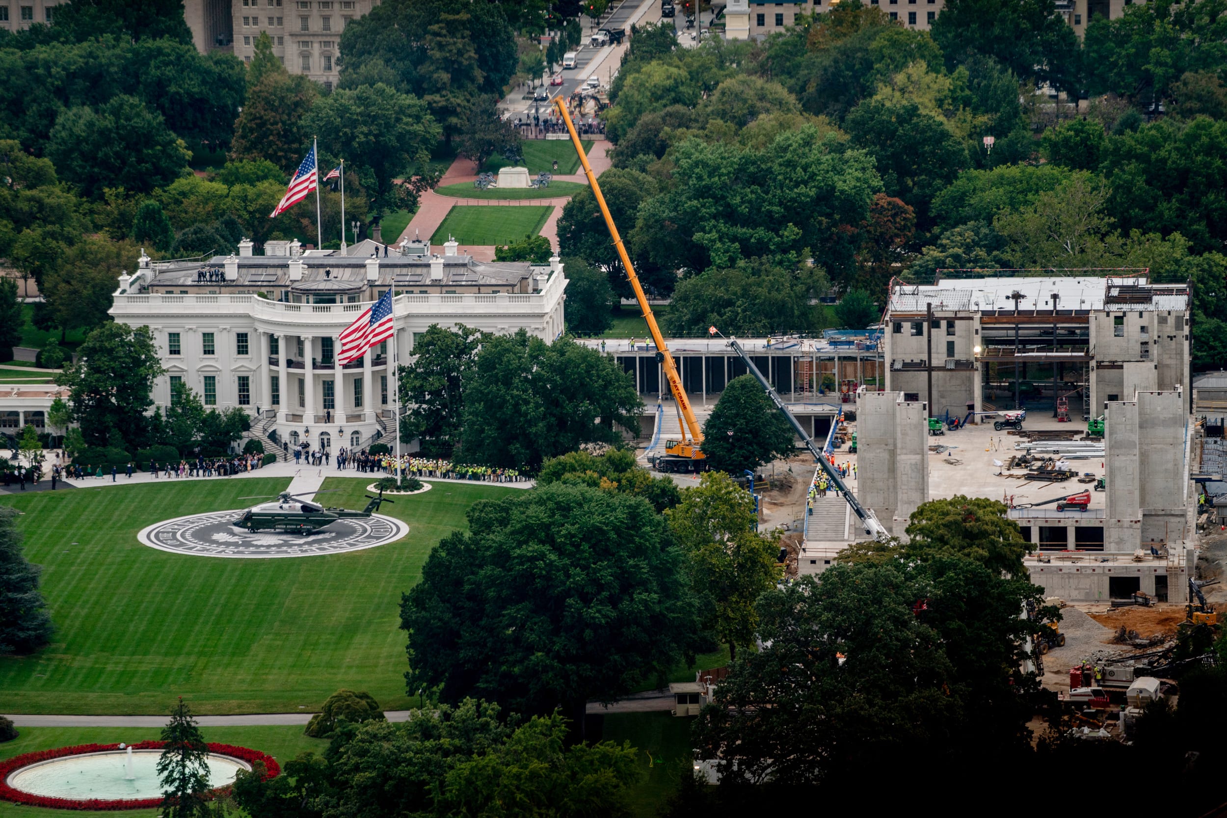 Marine One on the newly completed helipad on the South Lawn and the White House.