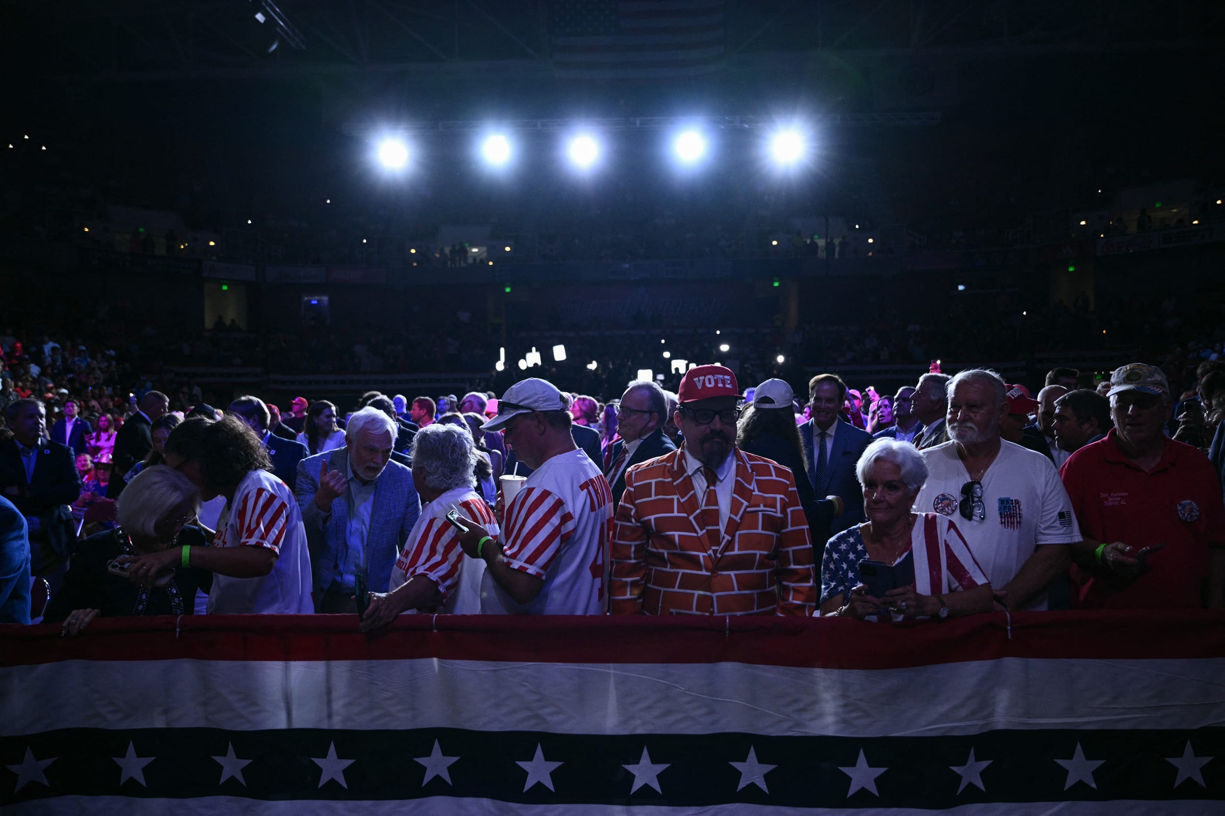 Supporters of US President Donald Trump wait for him.