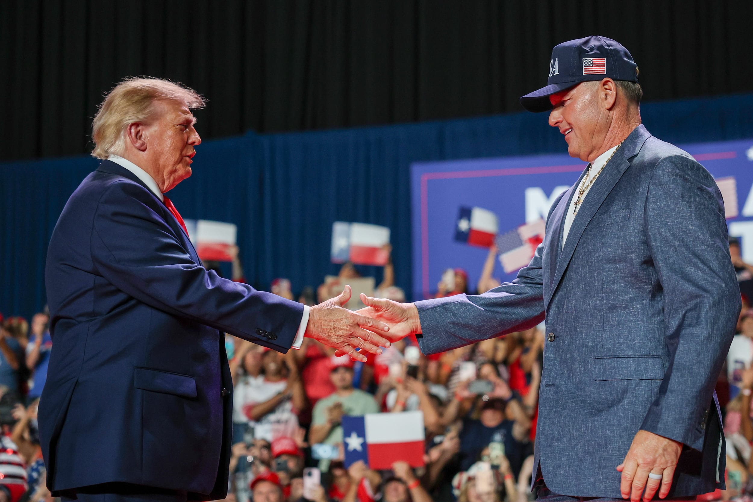 U.S. President Donald Trump, left, shakes hands with Former MLB player Roger Clemens.