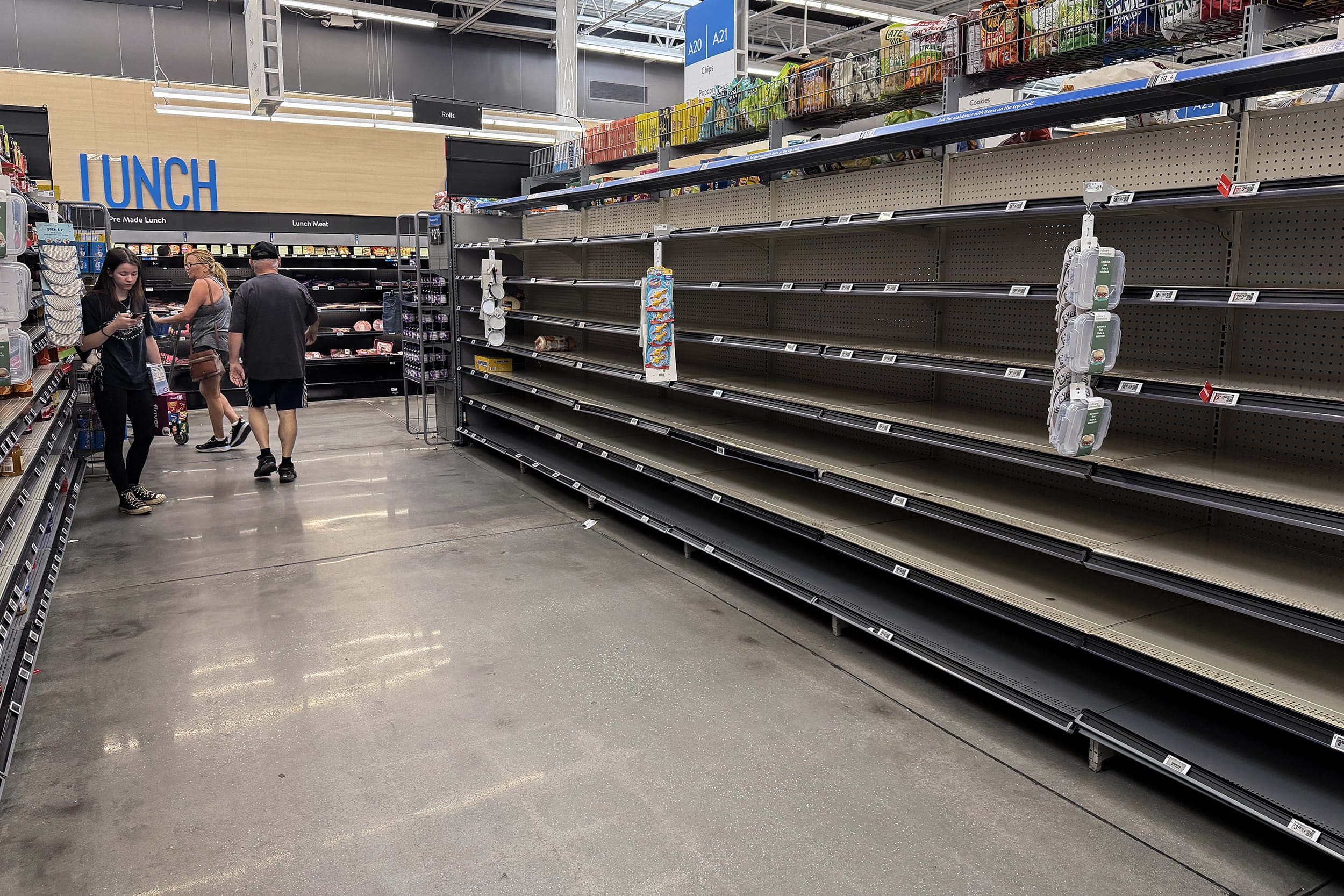 Empty grocery store shelves inside a store.