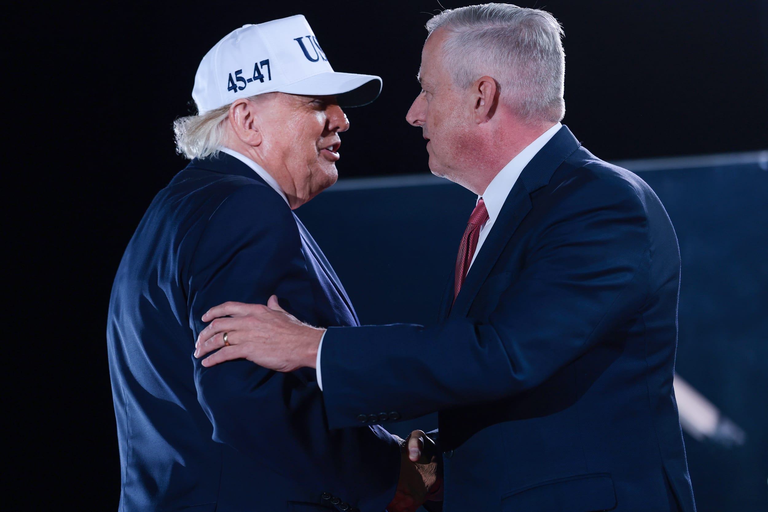 Michael Whatley, right, shakes hands with U.S. President Donald Trump 