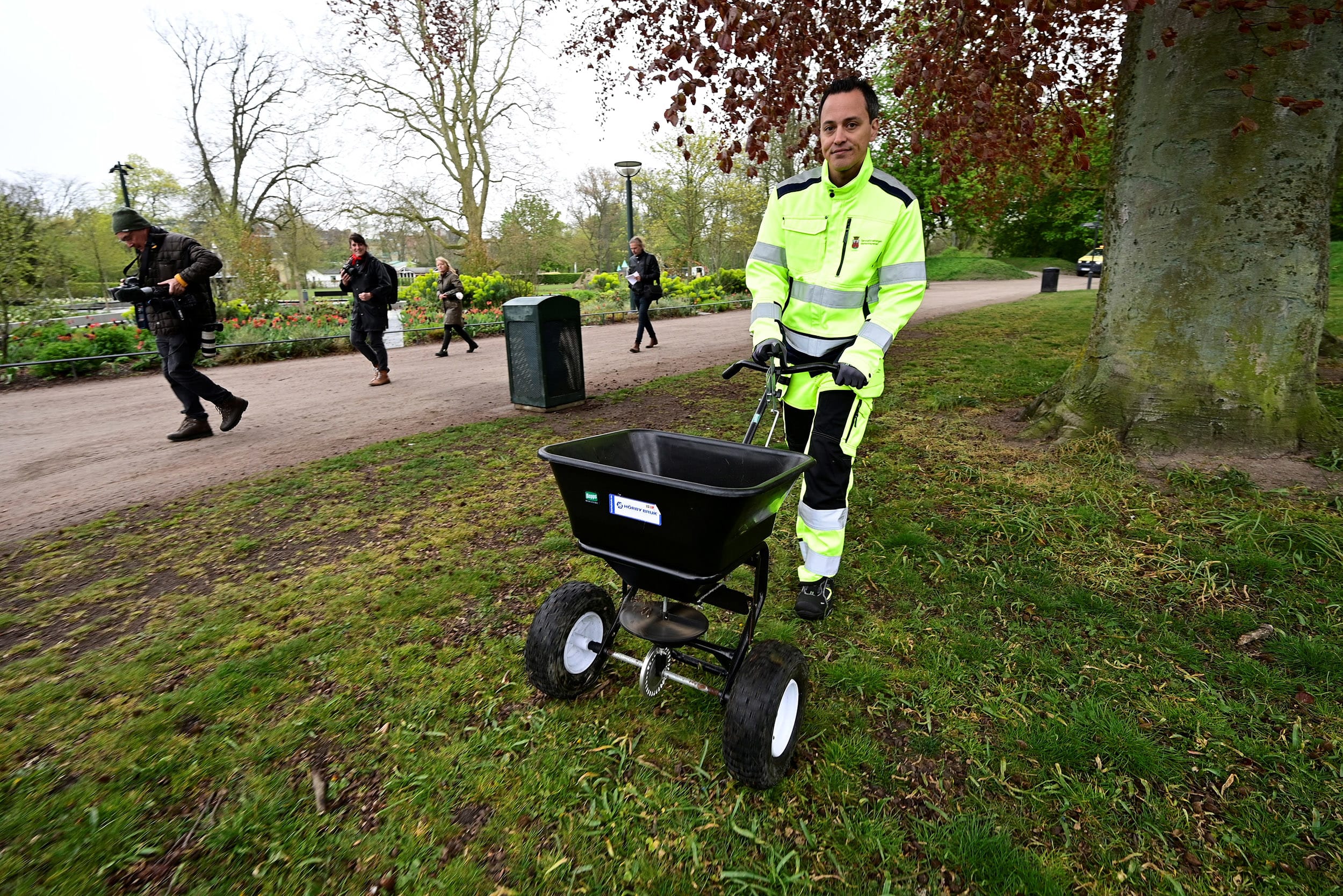 Image: Garden workers fertilise lawns in Stadsparken in an attempt to prevent residents from gathering there to mark the Walpurgis Night, in Lund